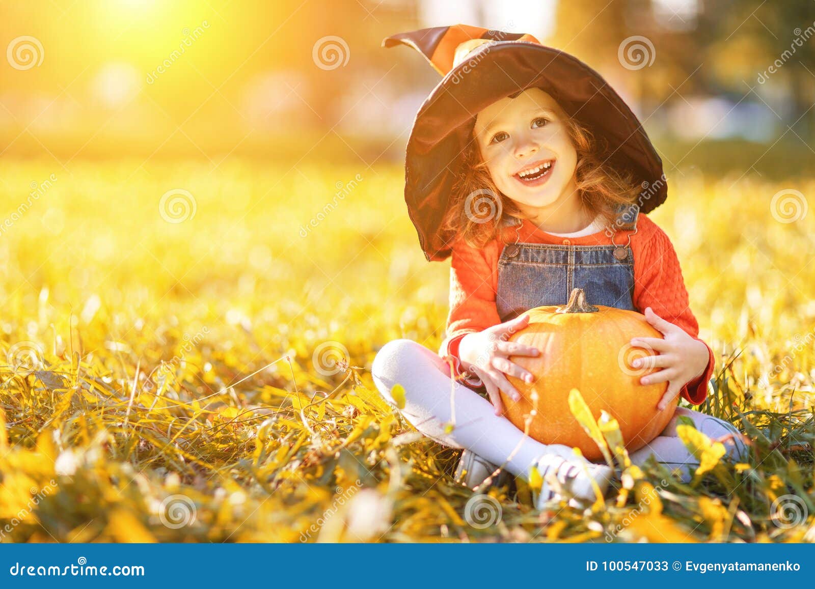 Child Girl with Pumpkin Outdoors in Halloween Stock Image - Image of ...