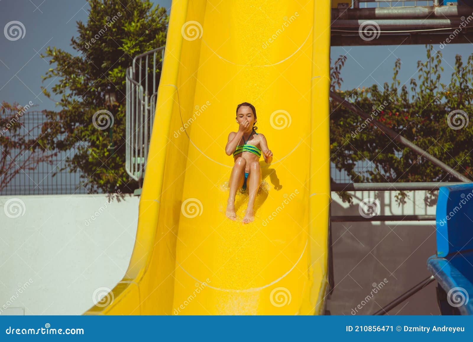 Child Sliding Down Water Slide in Pool Stock Image Image of