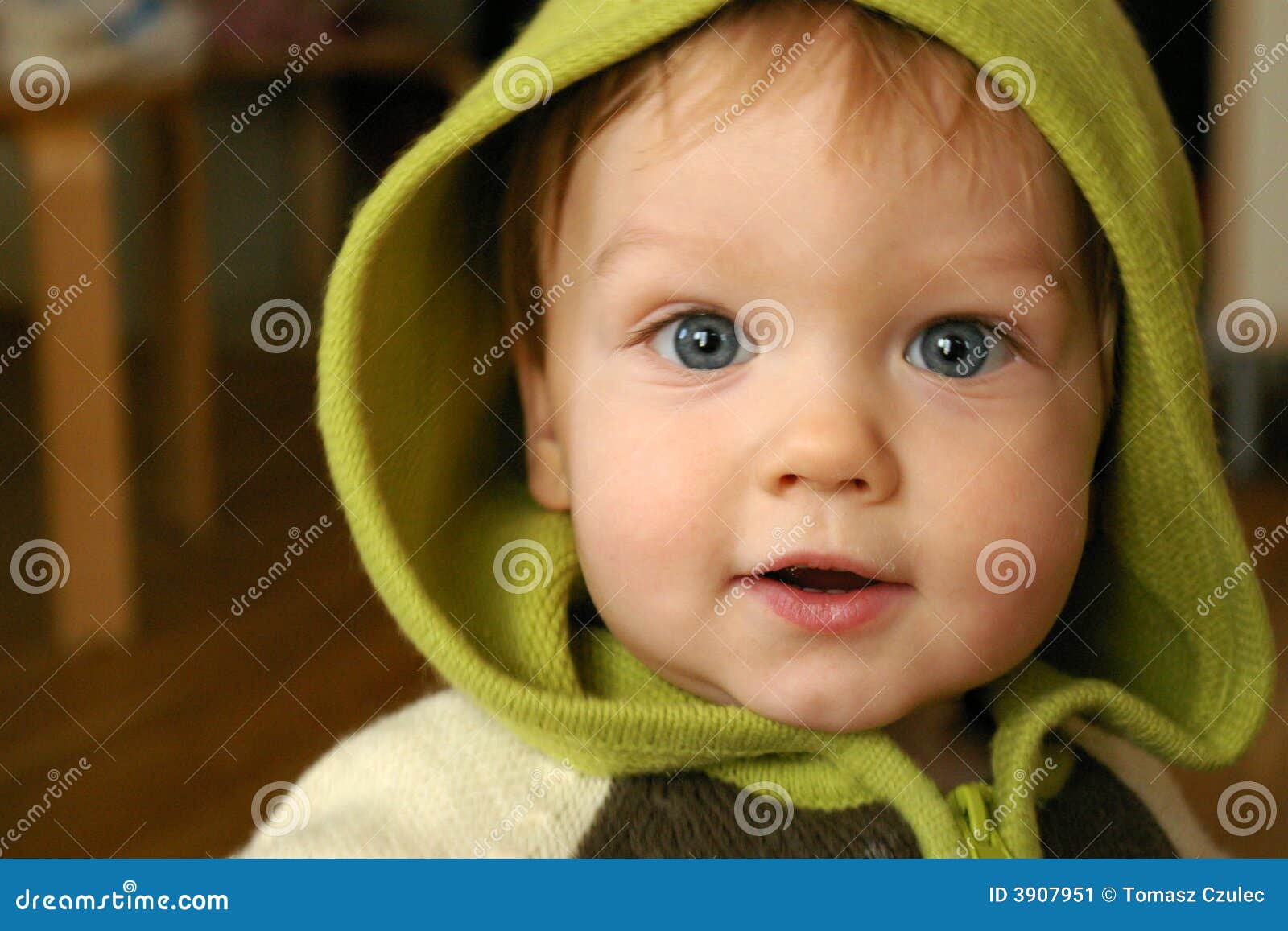 Child in green hood stock image. Image of portrait, baby - 3907951