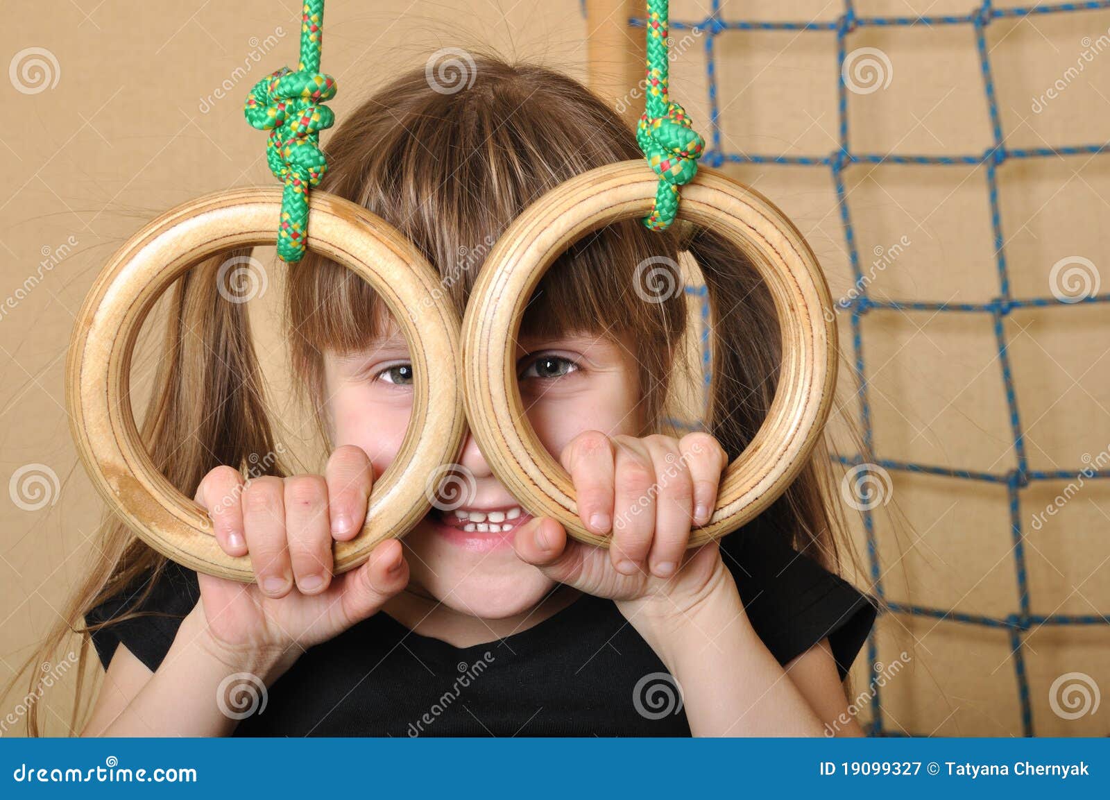 Child with gymnastic rings stock image. Image of equipment 19099327