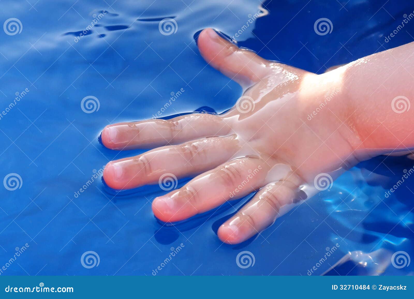 Child Hand Half Dipped In Water Of Blue Plastic Swimming ... Child Hand Half Dipped In Water Of Blue Plastic Swimming ...