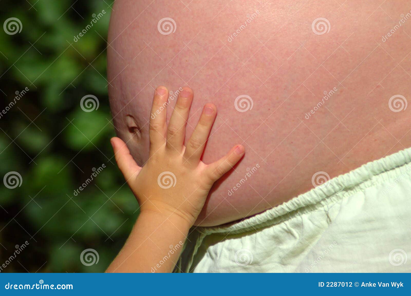 Child Hand On Mom's Belly Stock Photography Image 2287012