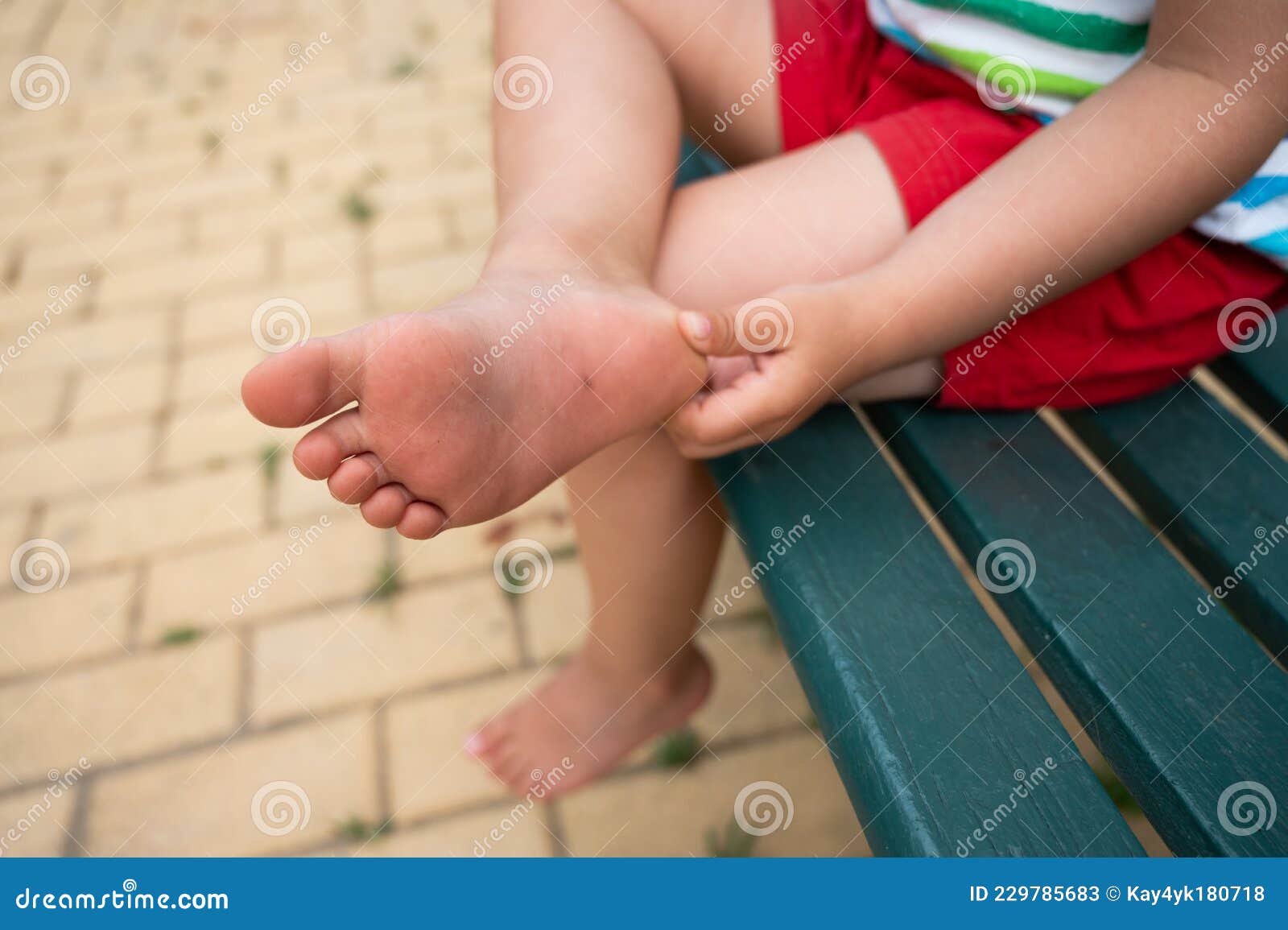 The Child Has Hurt His Foot Stock Image Image of innocence