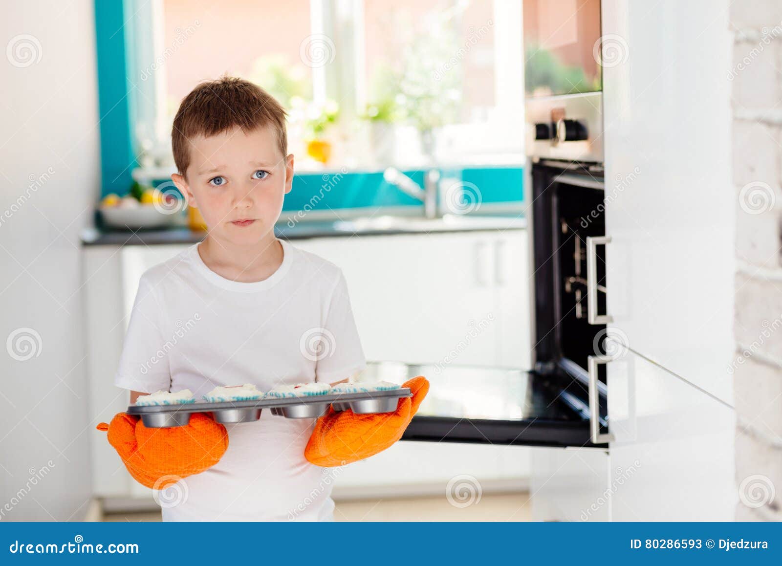 Child Holding Baking Tray with Cupcakes Stock Image Image of