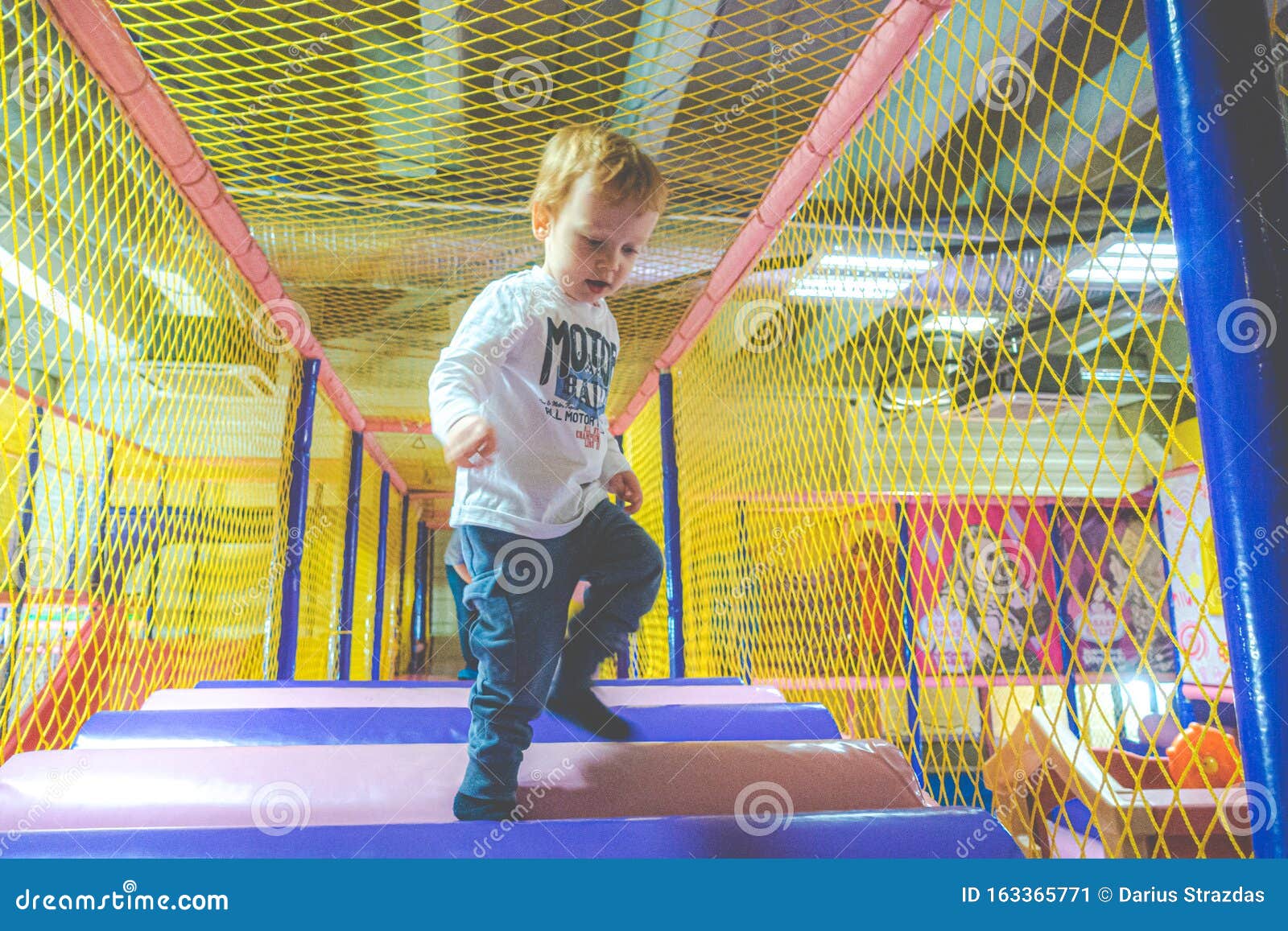 Child indoors active games stock image. Image of playing 163365771