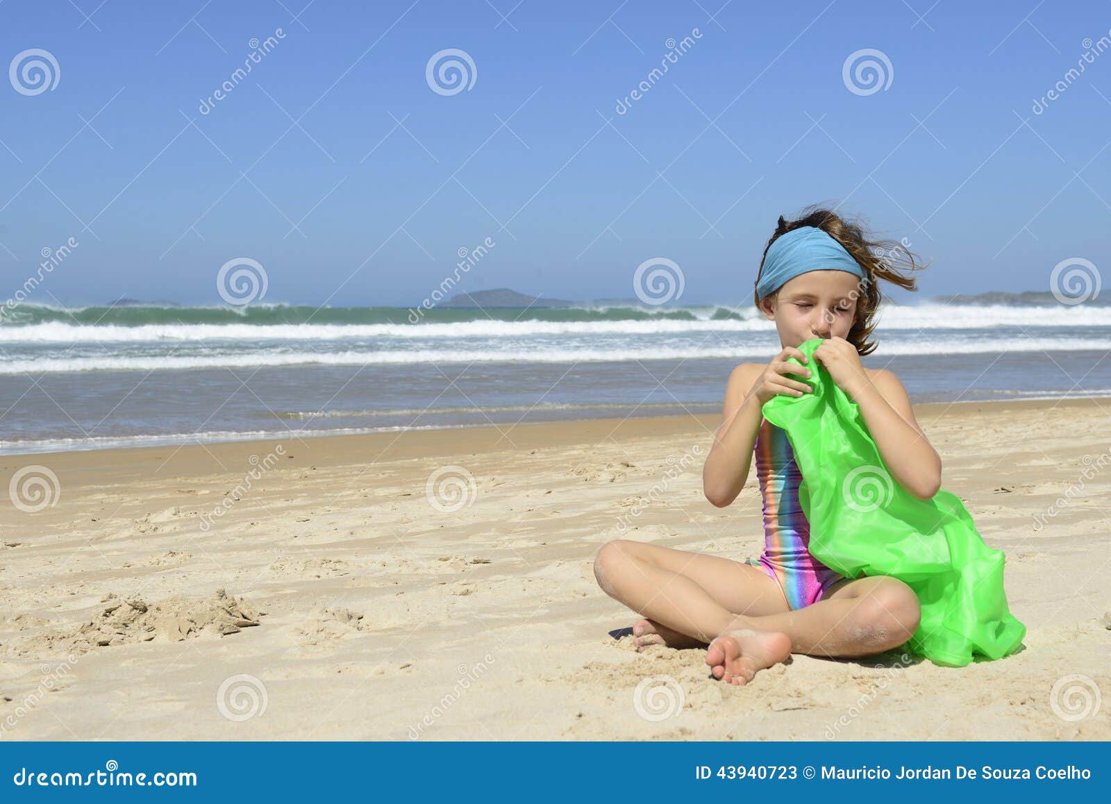 Child Inflating Inflatable Swim Ring on the Beach Stock Image Image