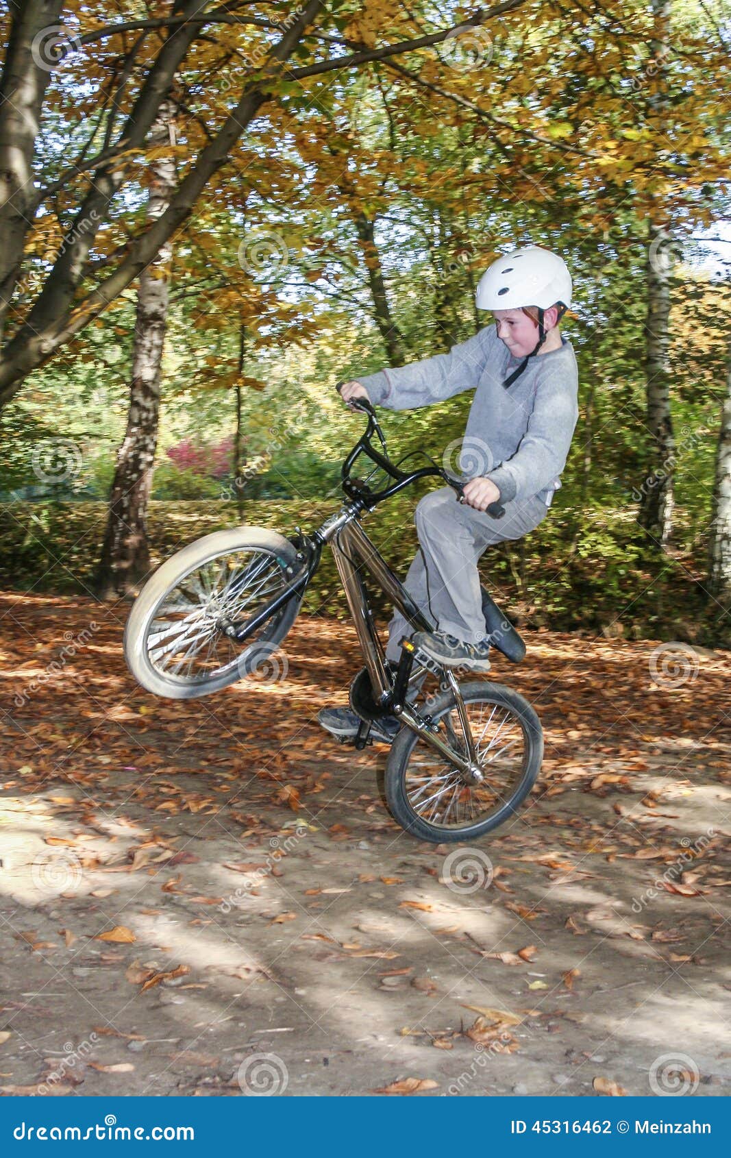 Child Jumping with the Bike at Stock Photo - Image of dirt, young: 45316462