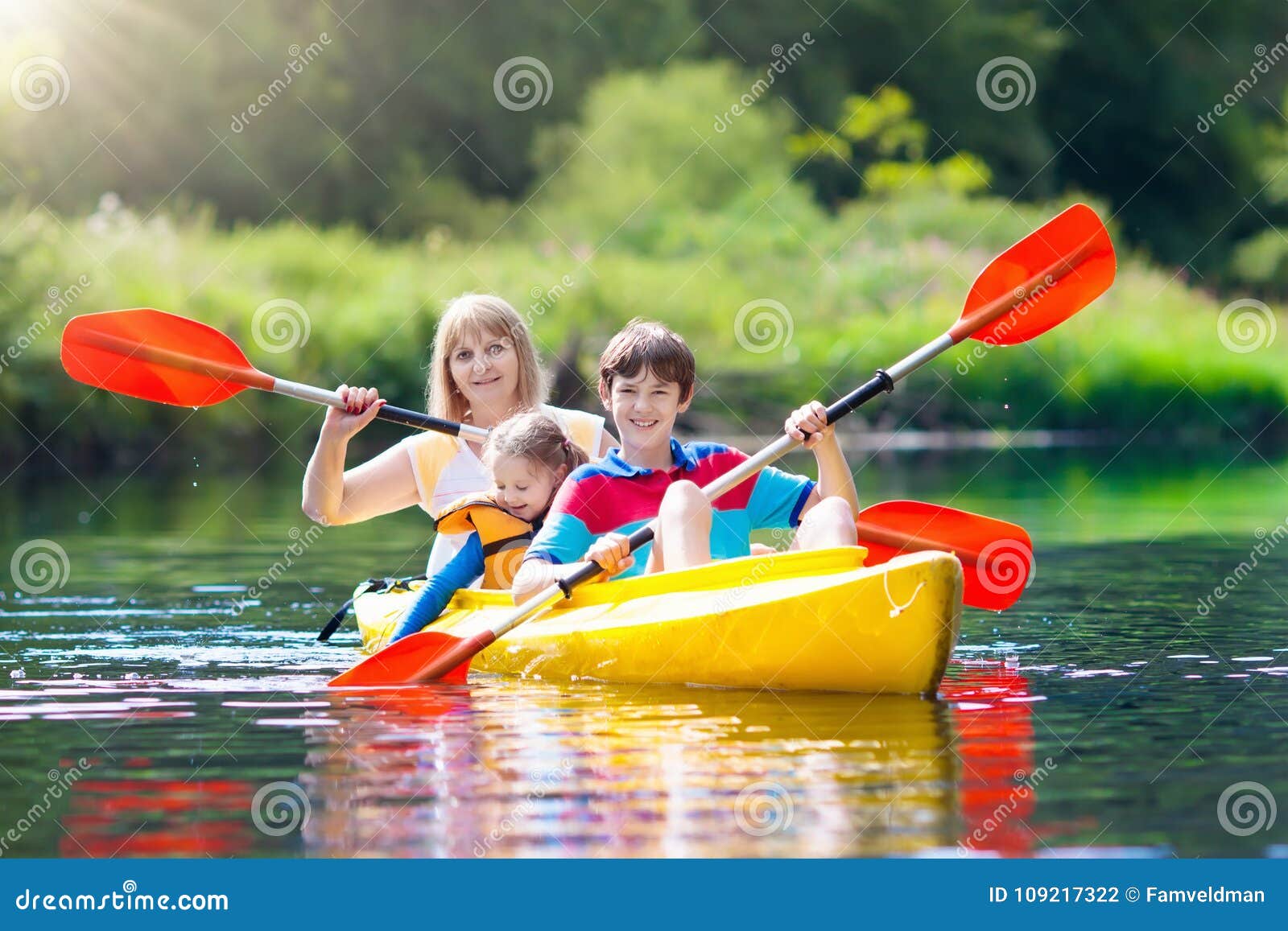 child on kayak. kids on canoe. summer camping.