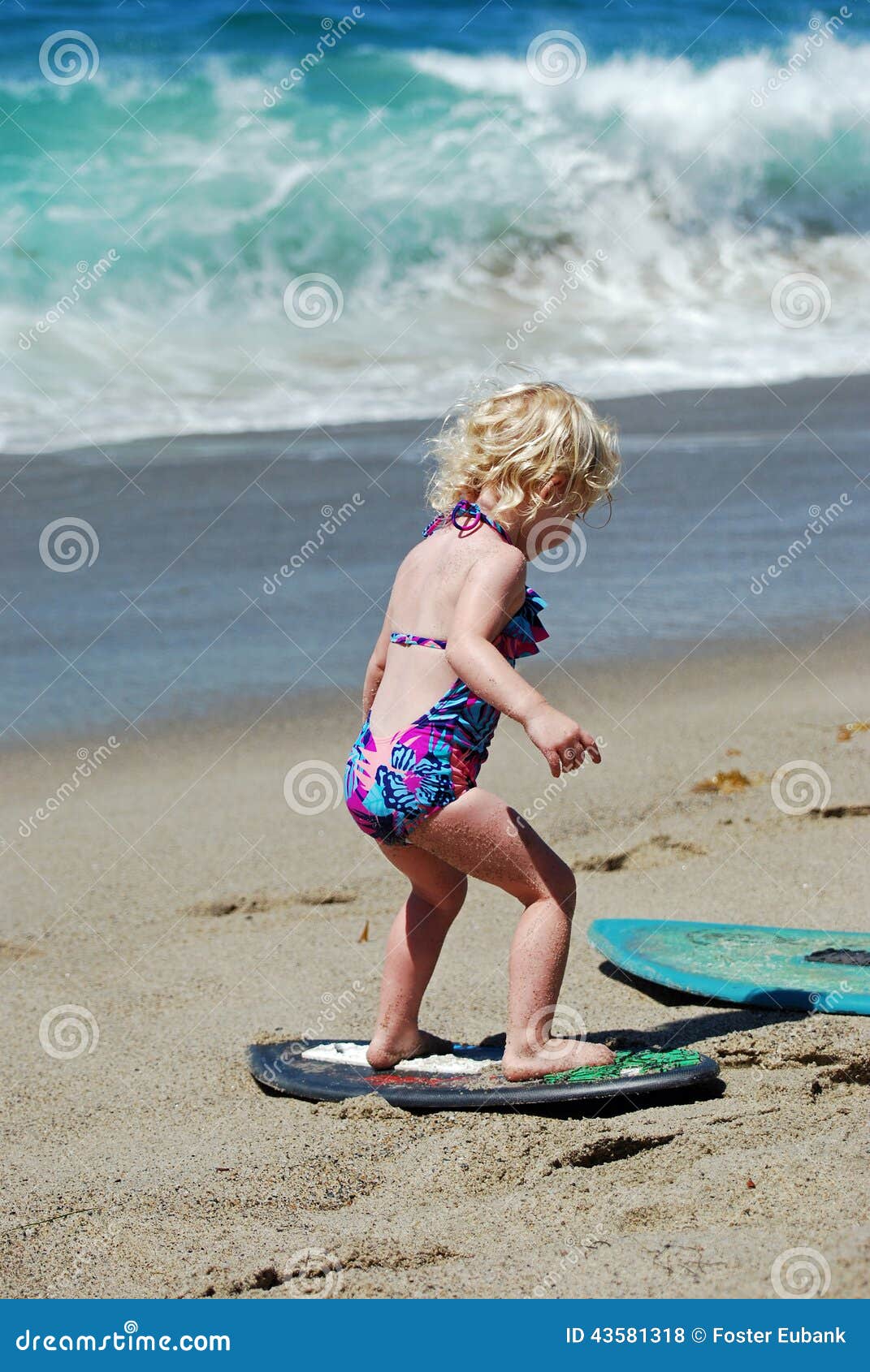 Child Learning How To Skimboard In Laguna Beach Ca Editorial throughout How To Skimboard