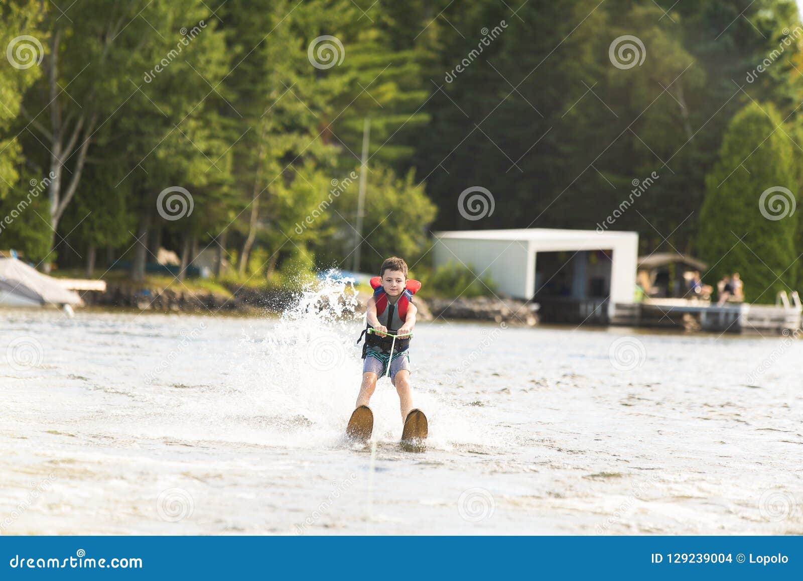 Child Learning To Water Skiing on a Lake Stock Photo Image of active