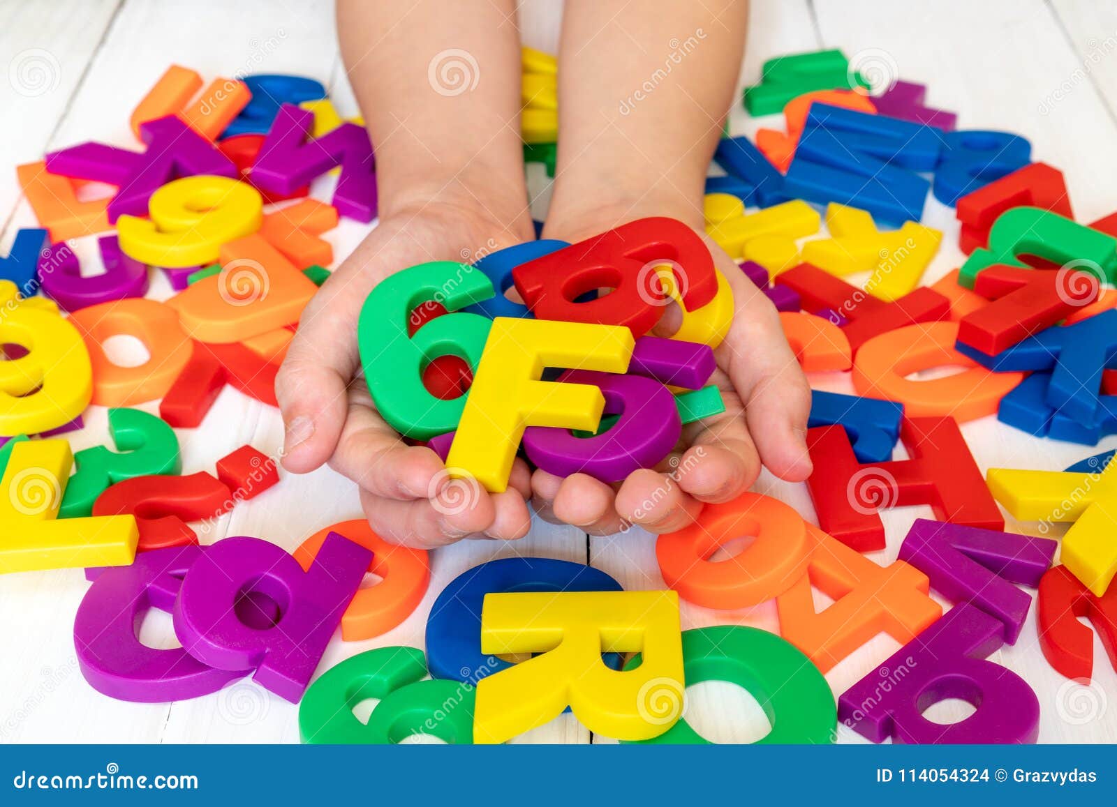 Child Learning Using Letters and Numbers Stock Photo Image of spell, education 114054324