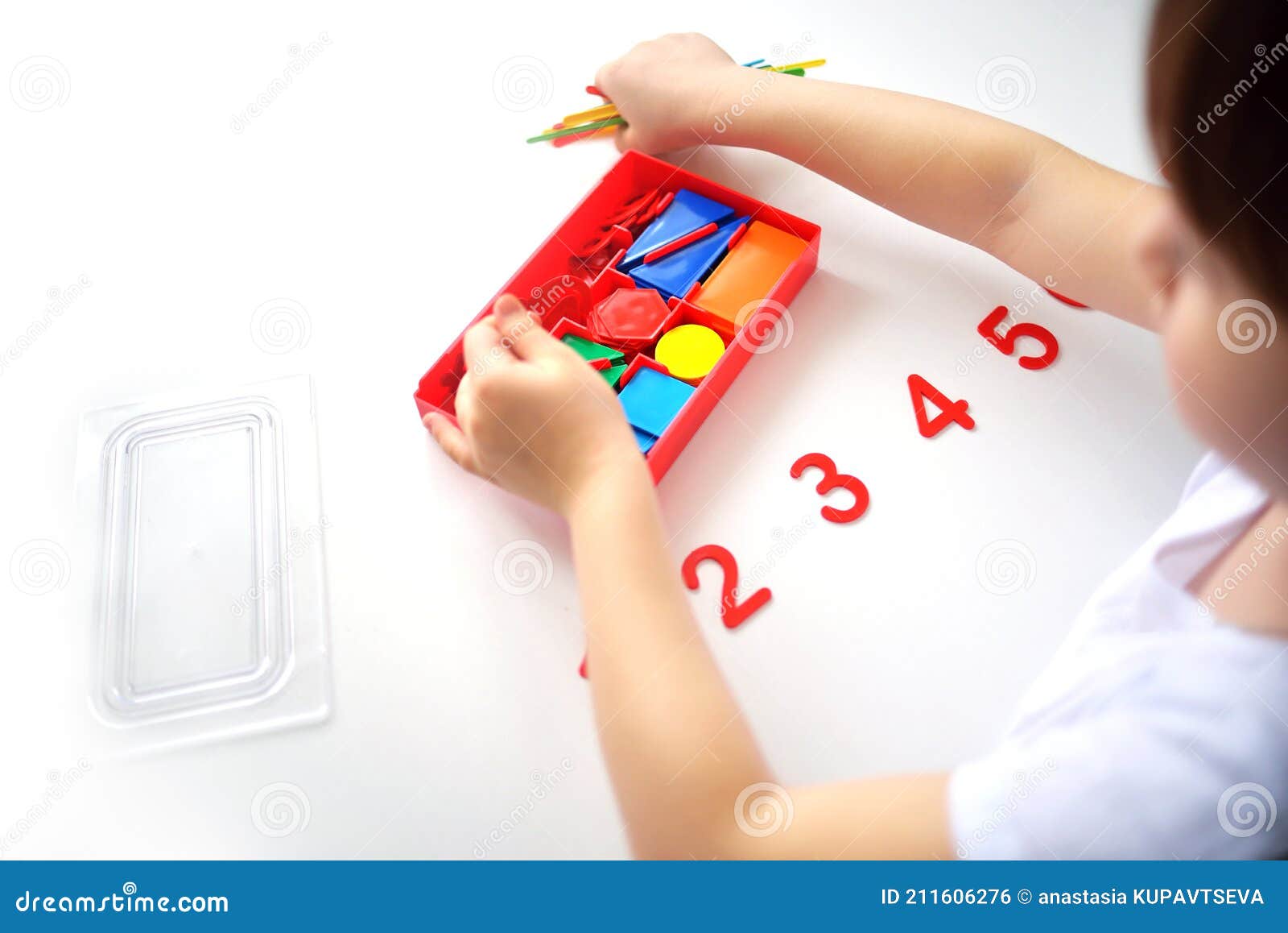 the child learns number line and geometric s. the preschooler works with montessori material.