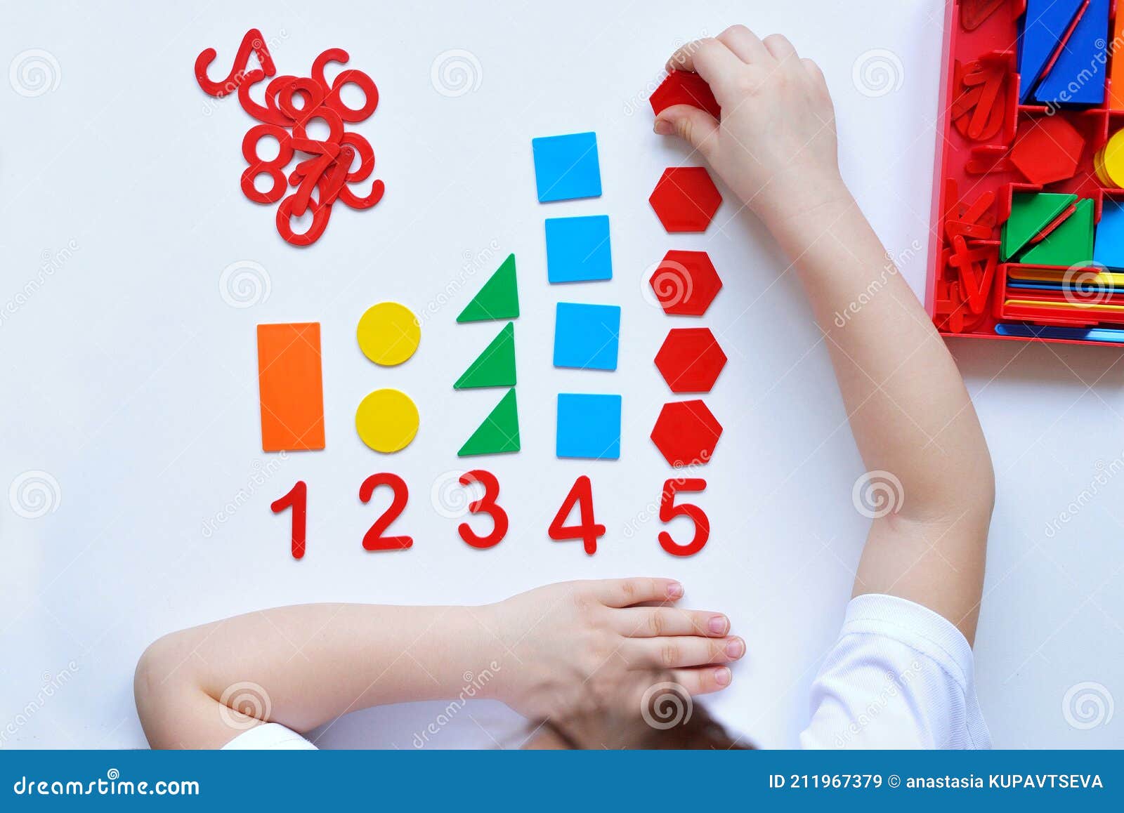 the child learns number line and geometric s. the preschooler works with montessori material