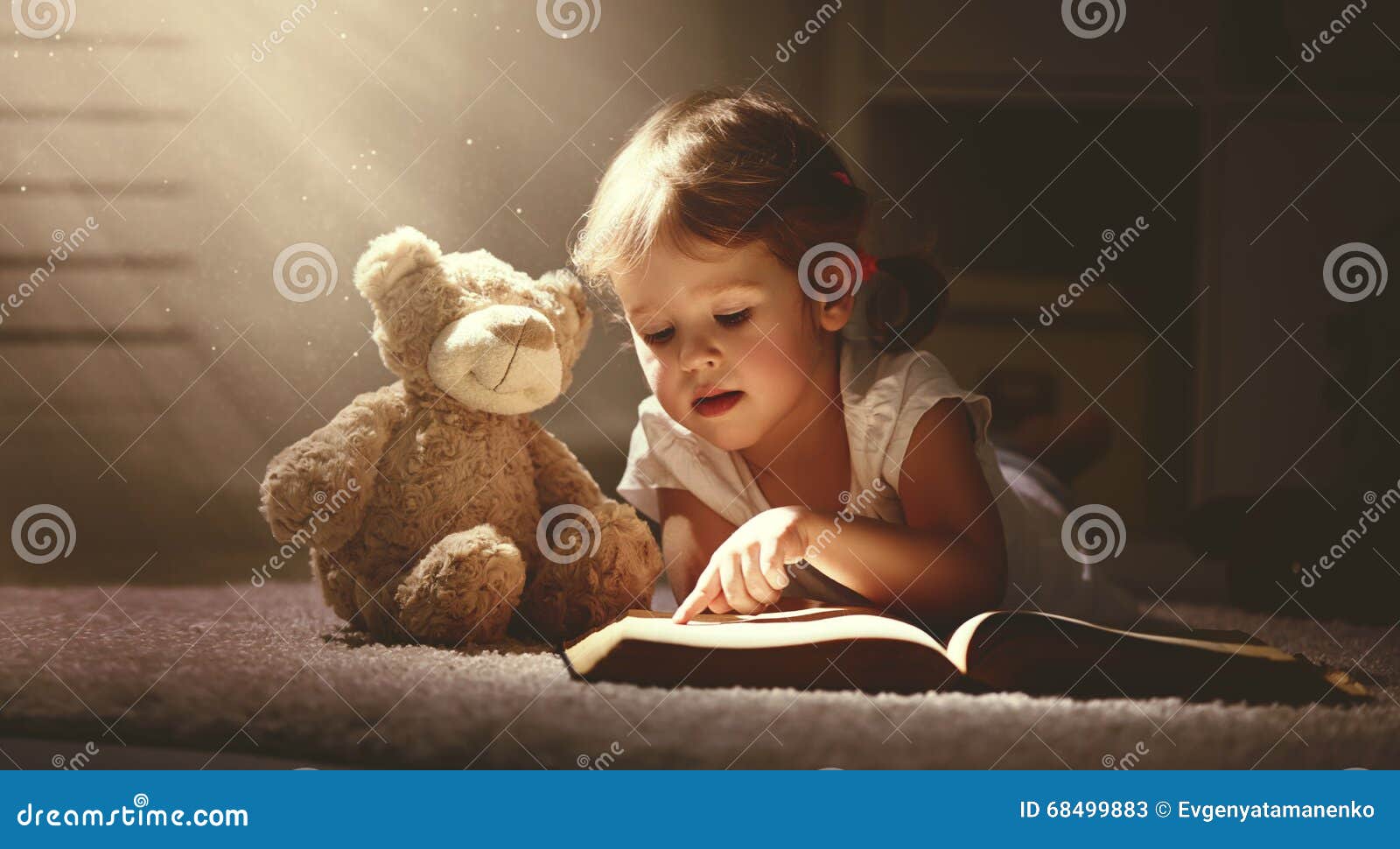 Child Little Girl Reading A Magic Book In Dark Home Stock Image Image Of Caucasian Female