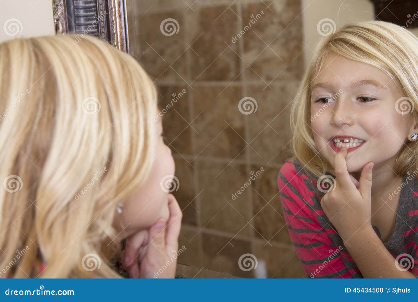Child Looking in Mirror at Missing Front Tooth Stock Photo Image of