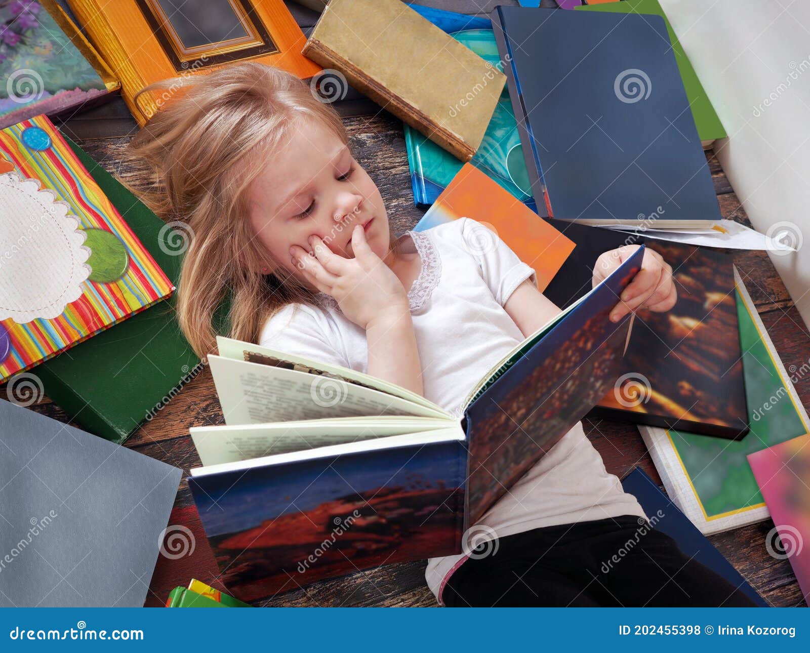 child and a lot of books around.