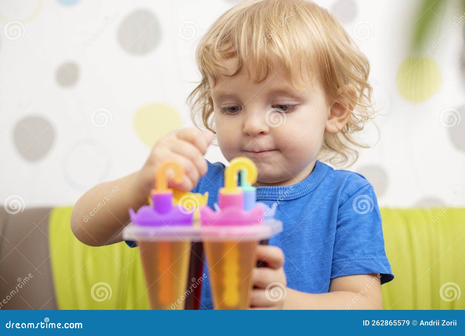 Child Making Ice Cream from Fruit Juice on Table at Home Stock Image