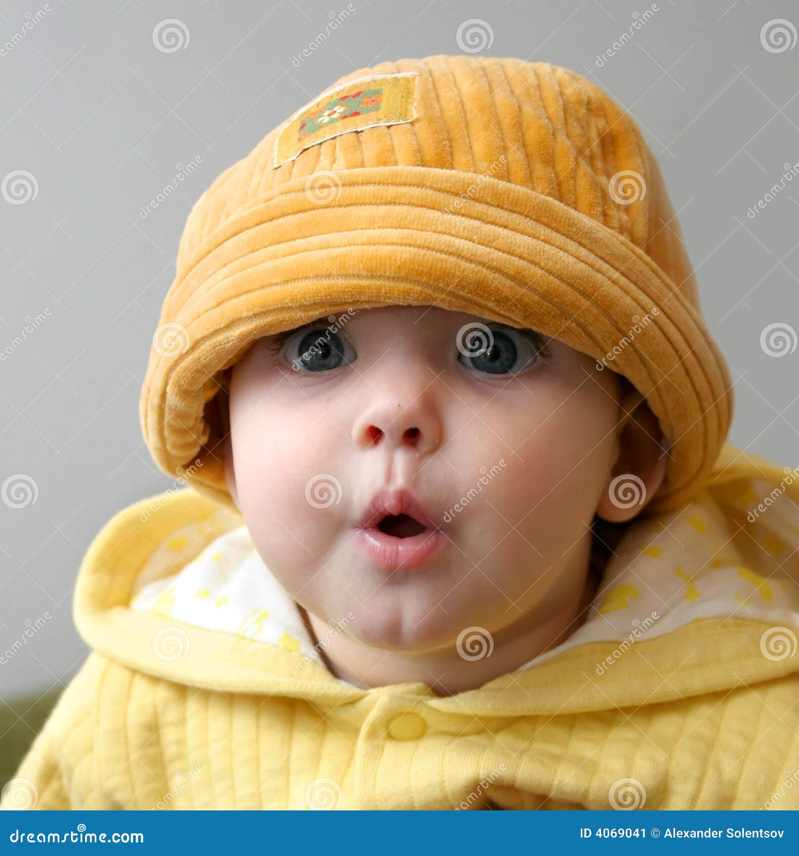 Child in an orange cap stock image. Image of playful, child - 4069041