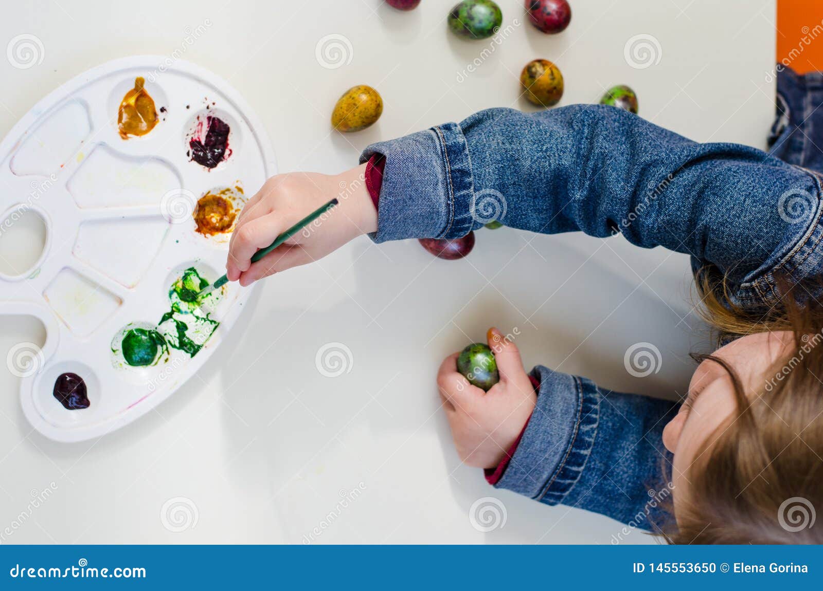 The Child Paint Easter Eggs with Palette Stock Photo Image of easter