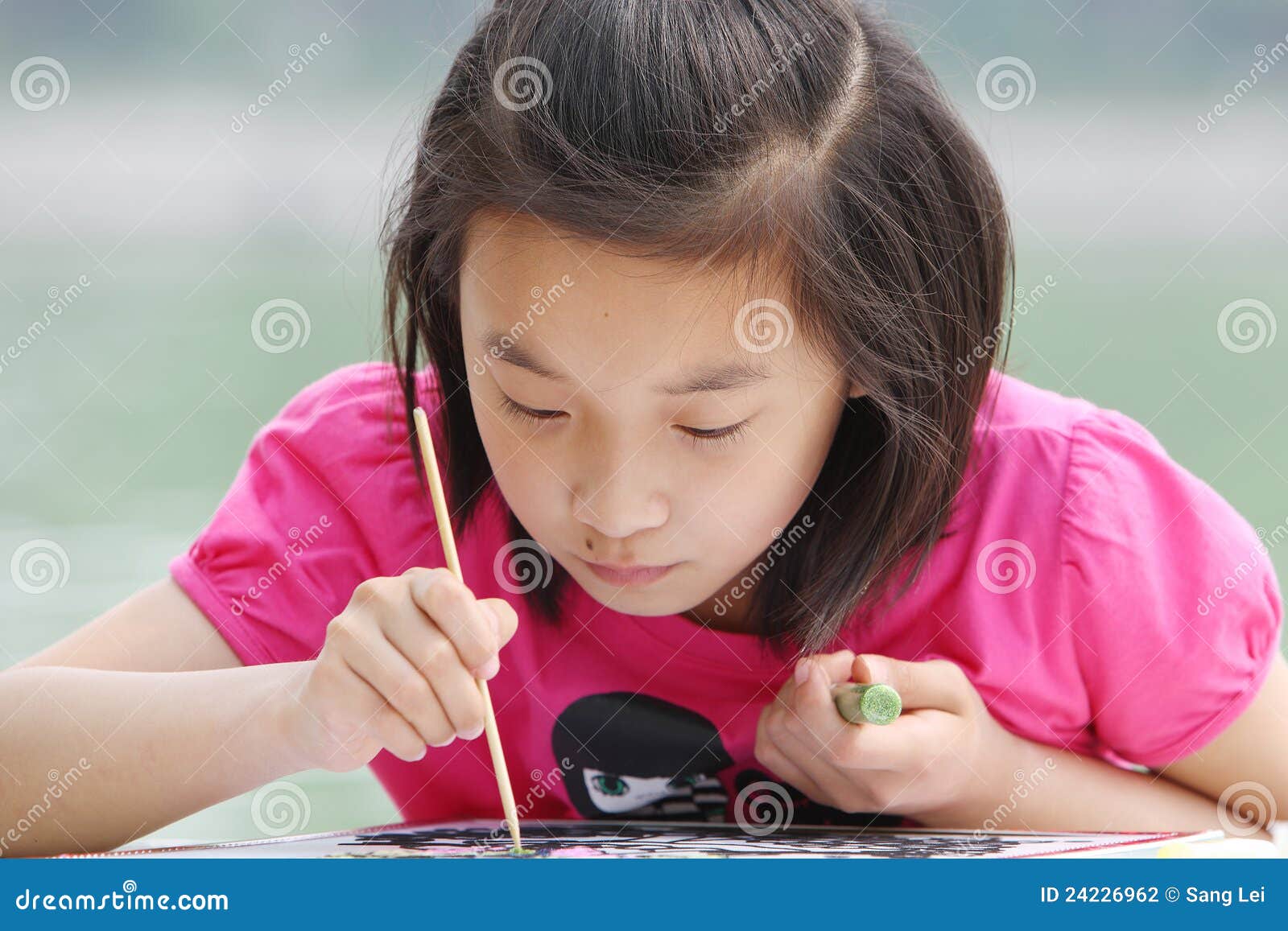 child painting absorbed