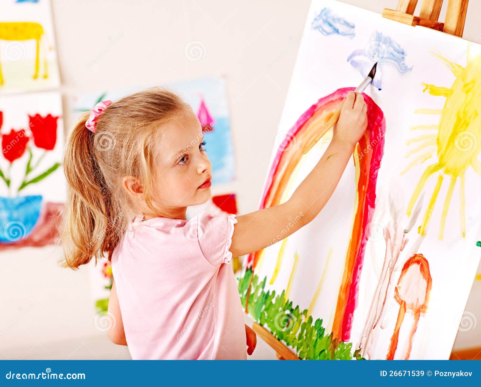 Child Painting At Easel. Royalty Free Stock Images - Image: 26671539