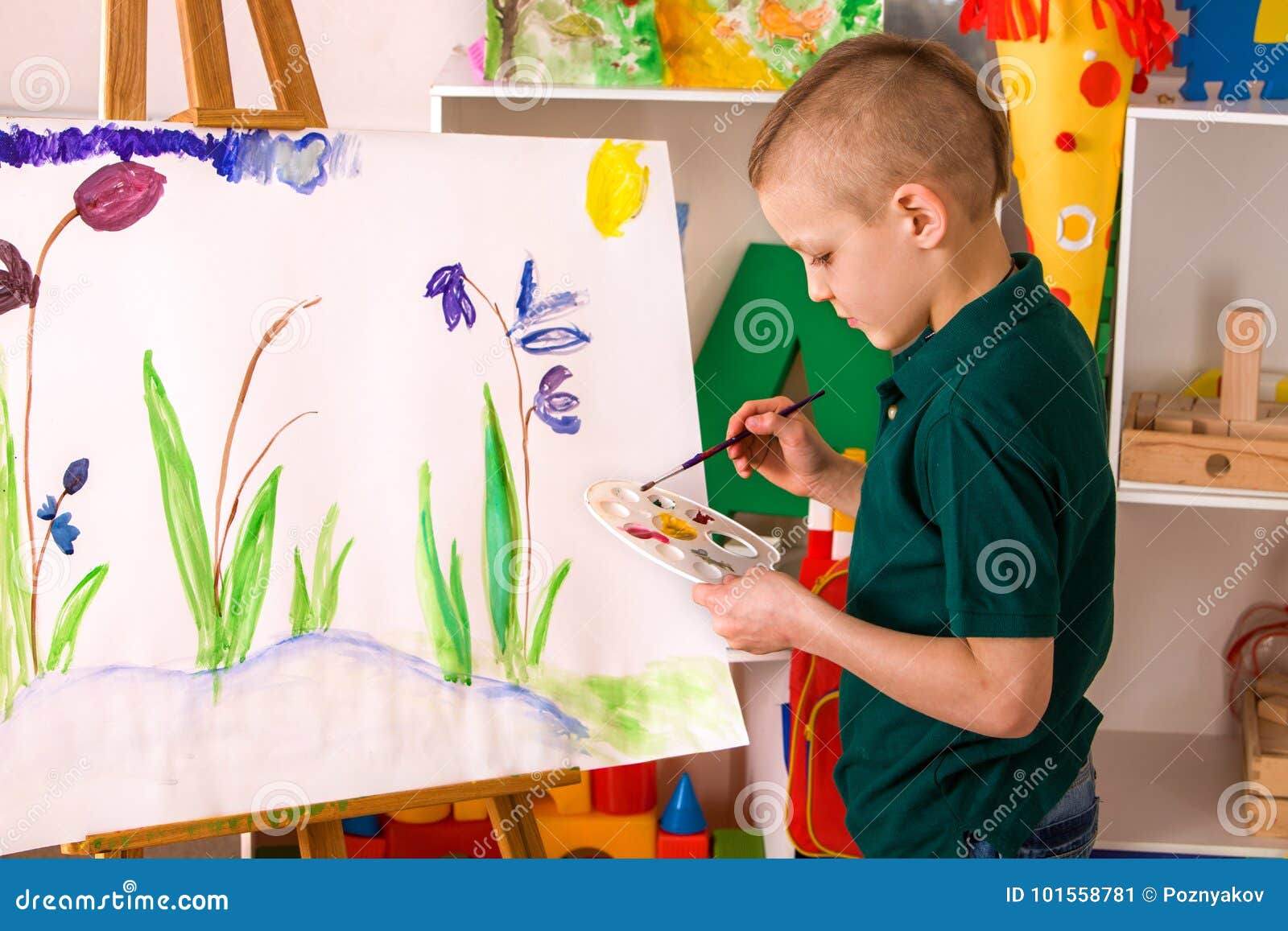 Child Painting Finger On Easel. Kid Boy Learn Paint School