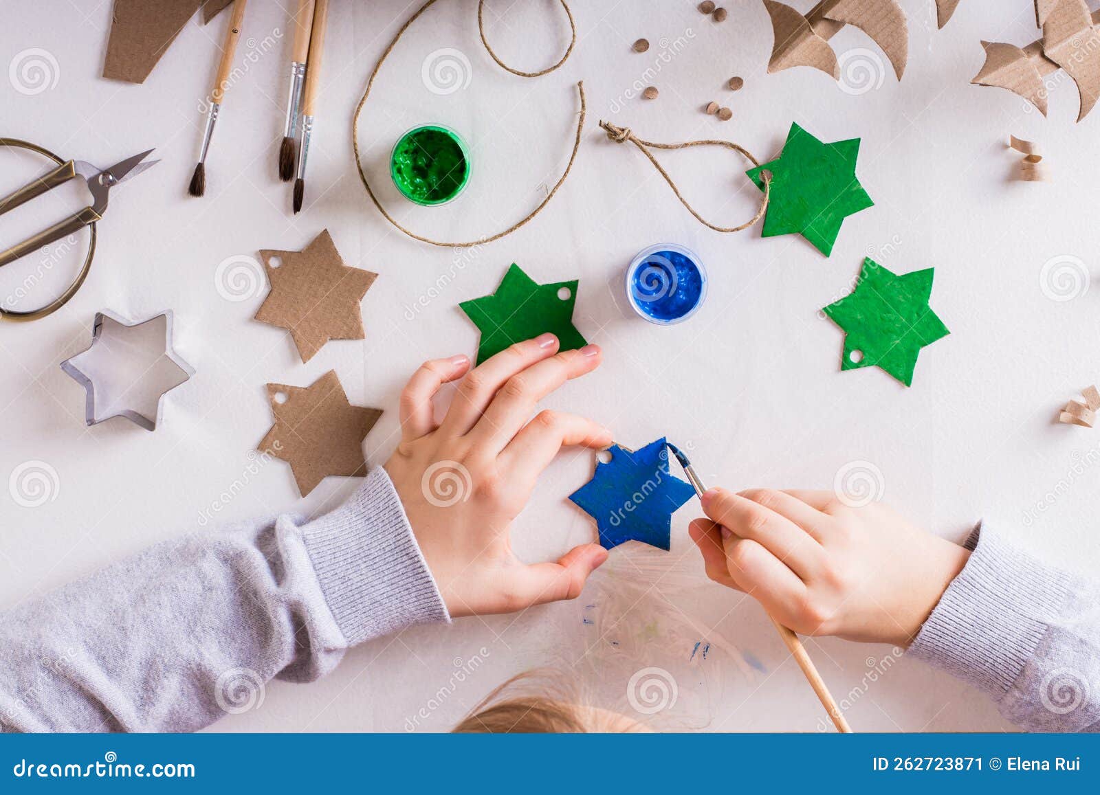 A Child Paints a Gouache Star from Cardboard for DIY Christmas Handmade ...