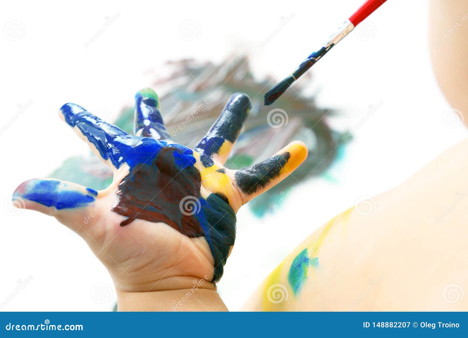 Child Paints with Paint Your Hand. Creativity and Artistic Hobby Stock