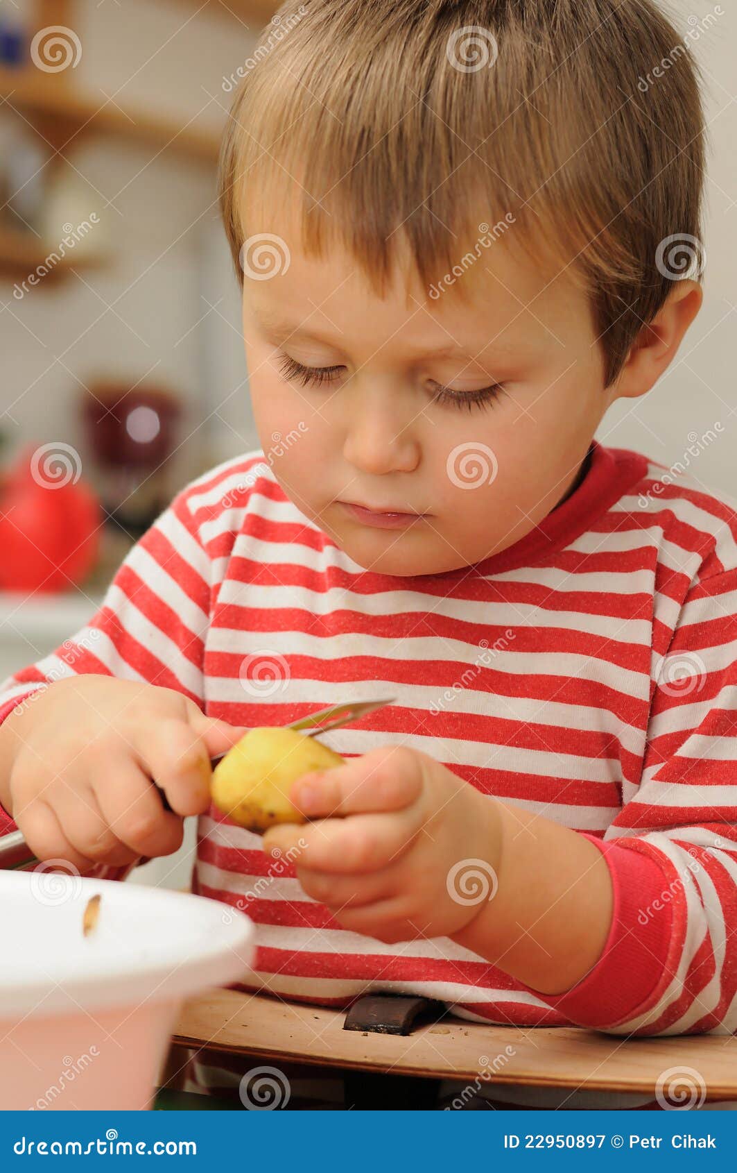 Child peeling potato stock image. Image of skillful, kitchen 22950897