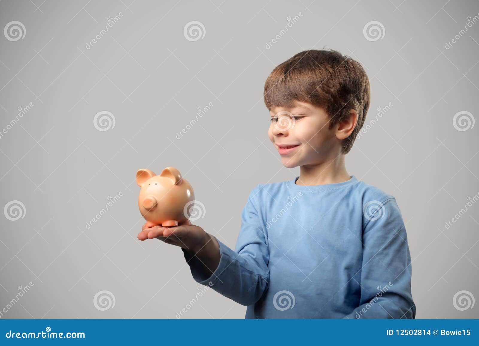 Child and piggy bank stock photo. Image of smile, business 12502814