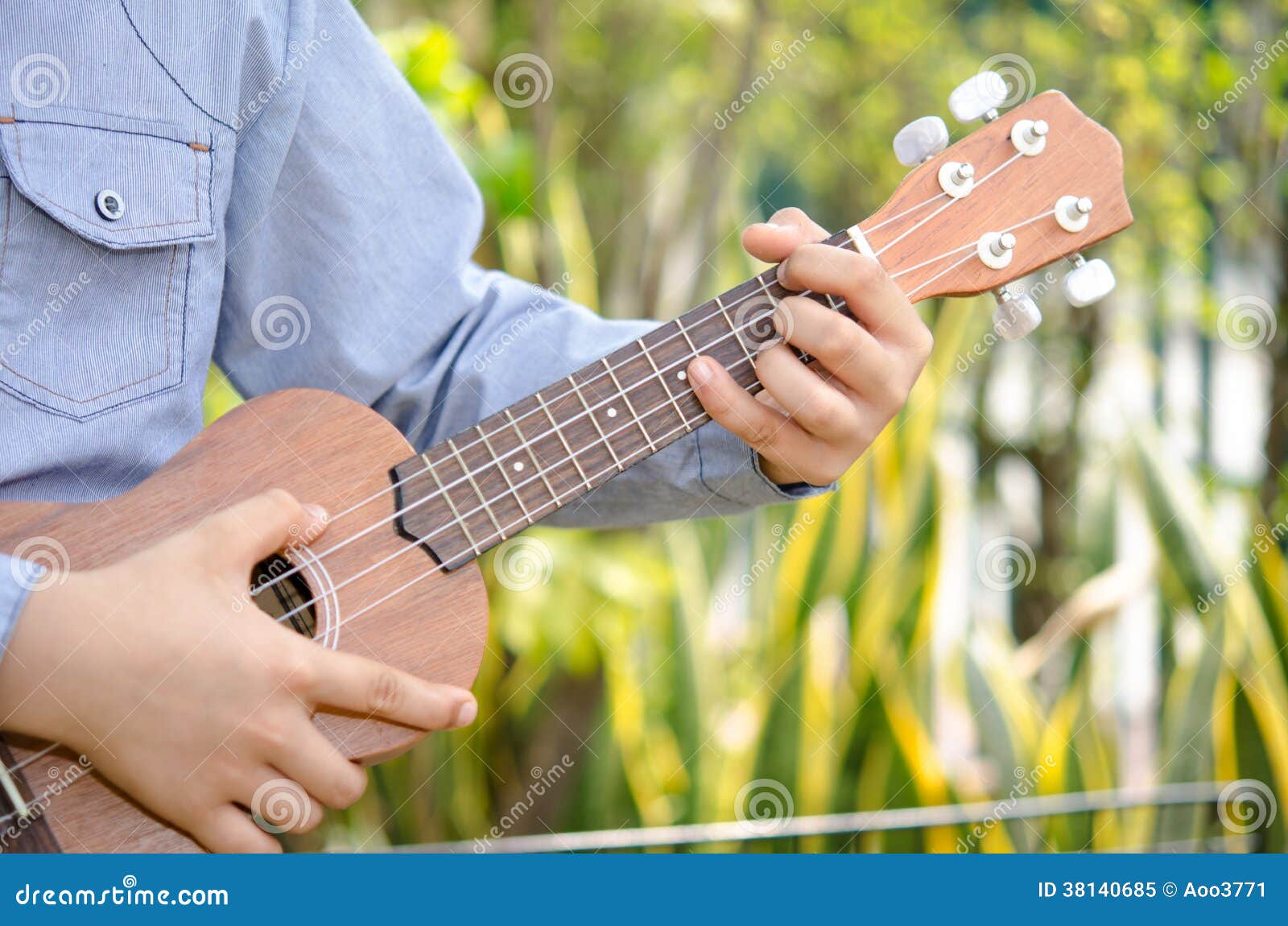 Child Play the ukulele stock image. Image of cute, child 38140685