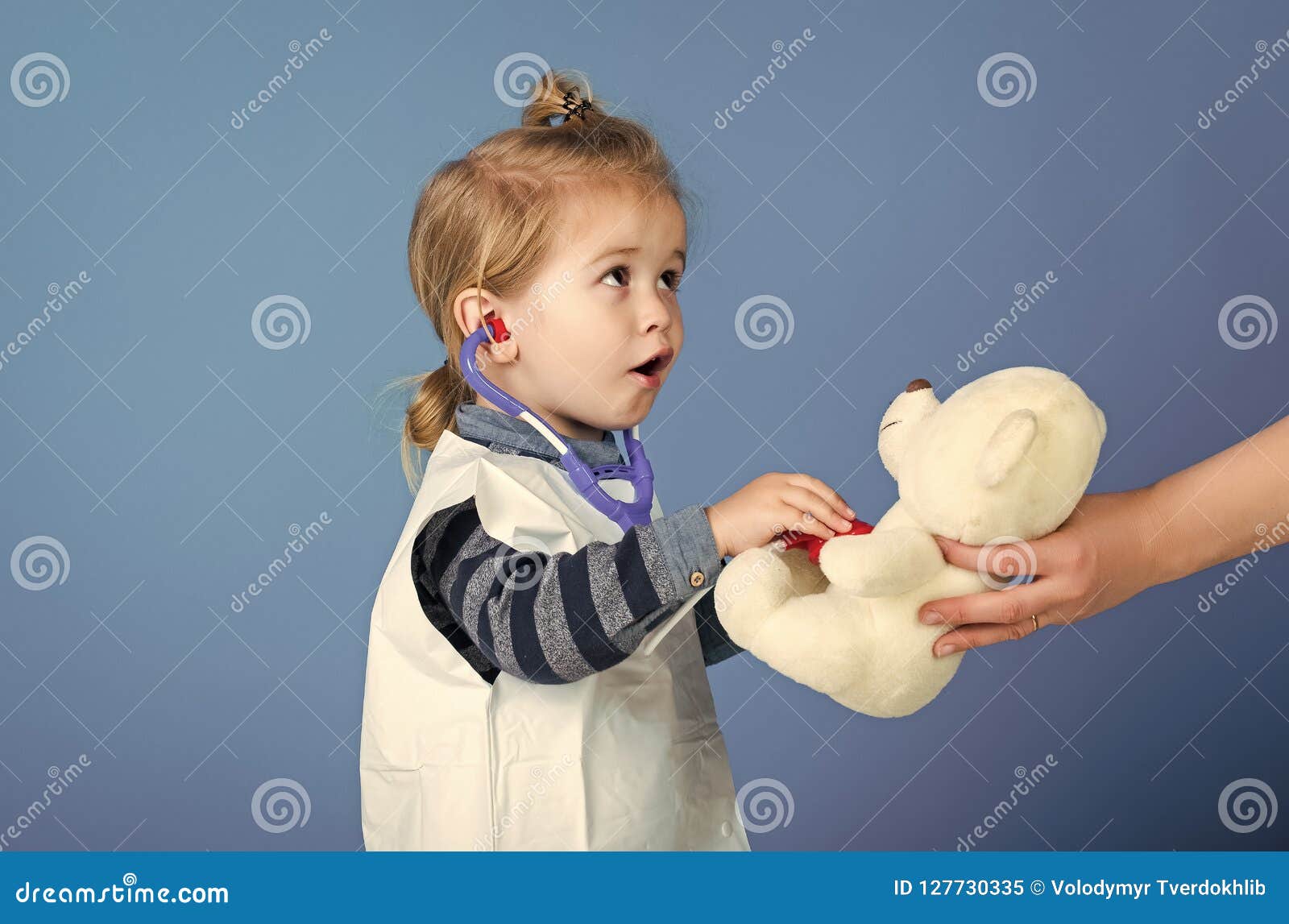 Child Play Veterinarian with Teddy Bear in Mothers Hand Stock Image