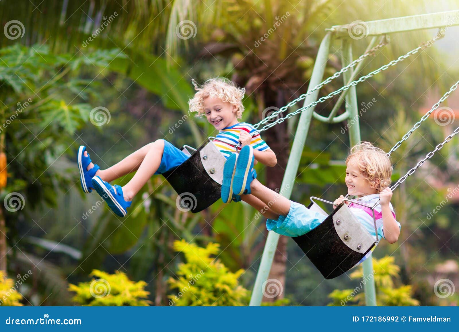 child on playground. swing kids play outdoor