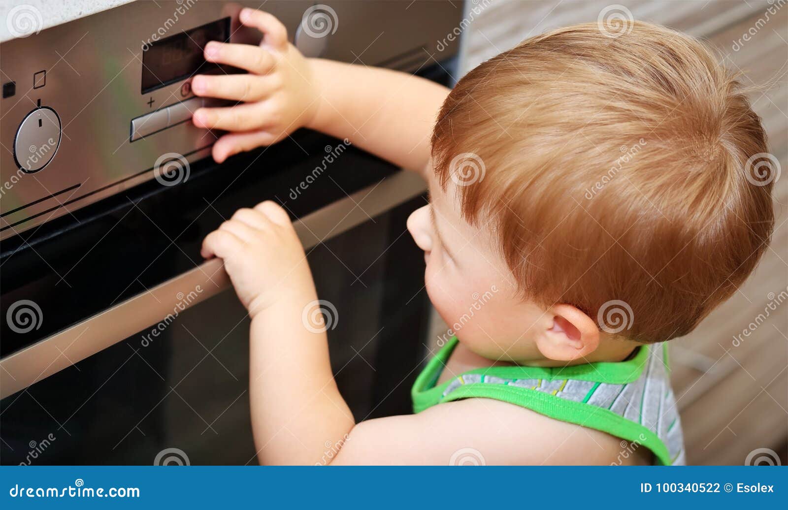 Child Playing with Electric Oven. Stock Photo Image of heat, hazard