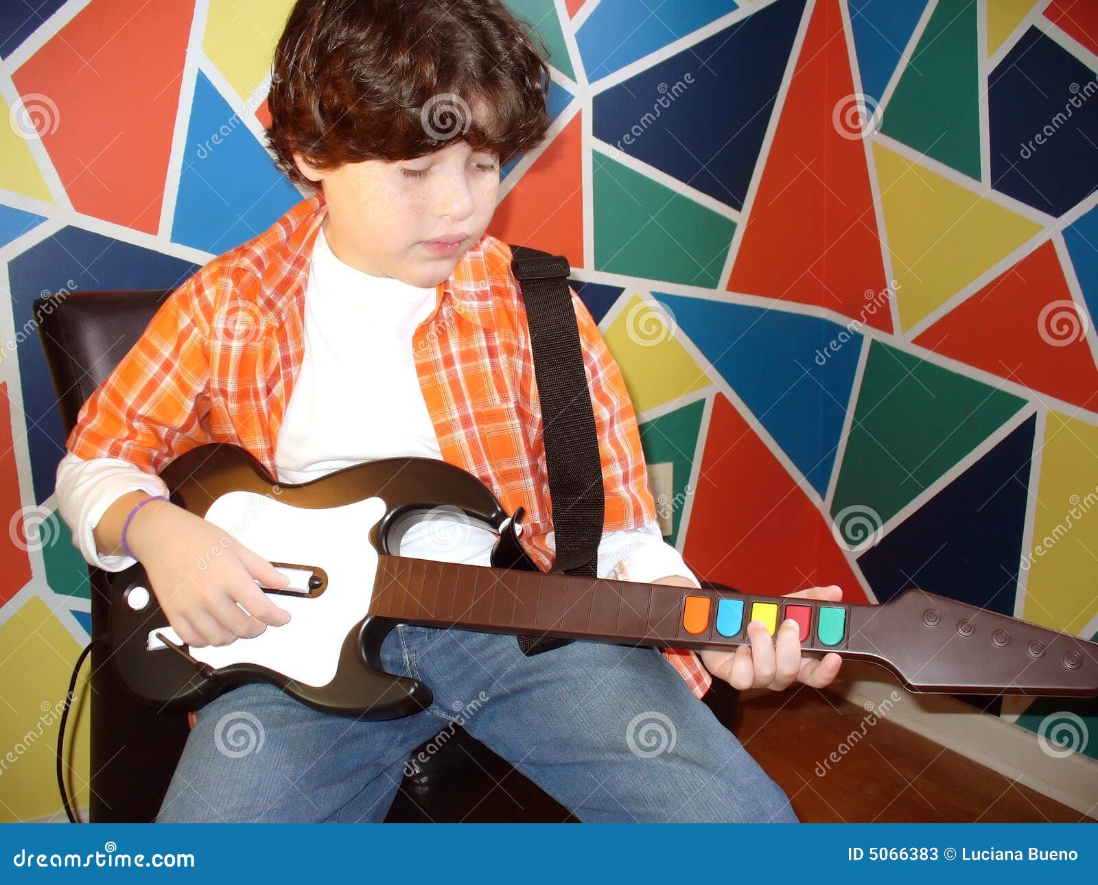 Child playing guitar stock image. Image of colorful, 5066383