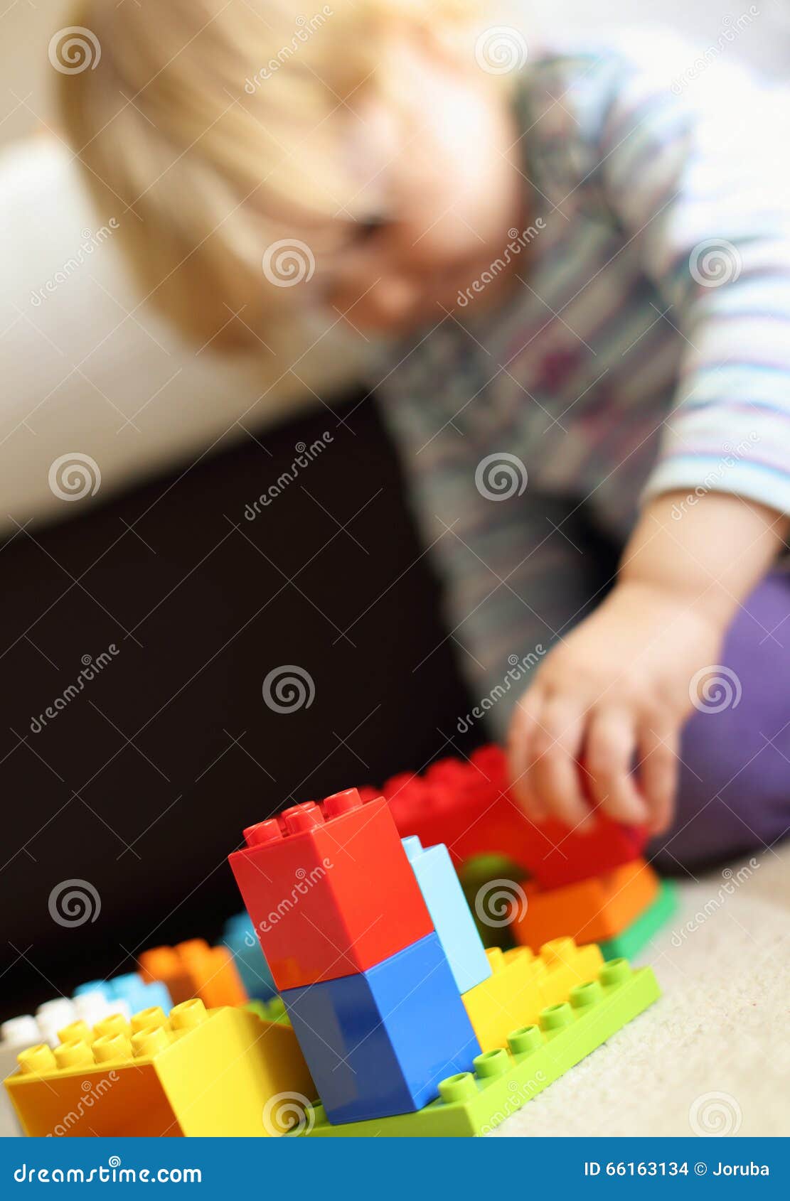 Child playing Lego bricks stock photo. Image of cute 66163134
