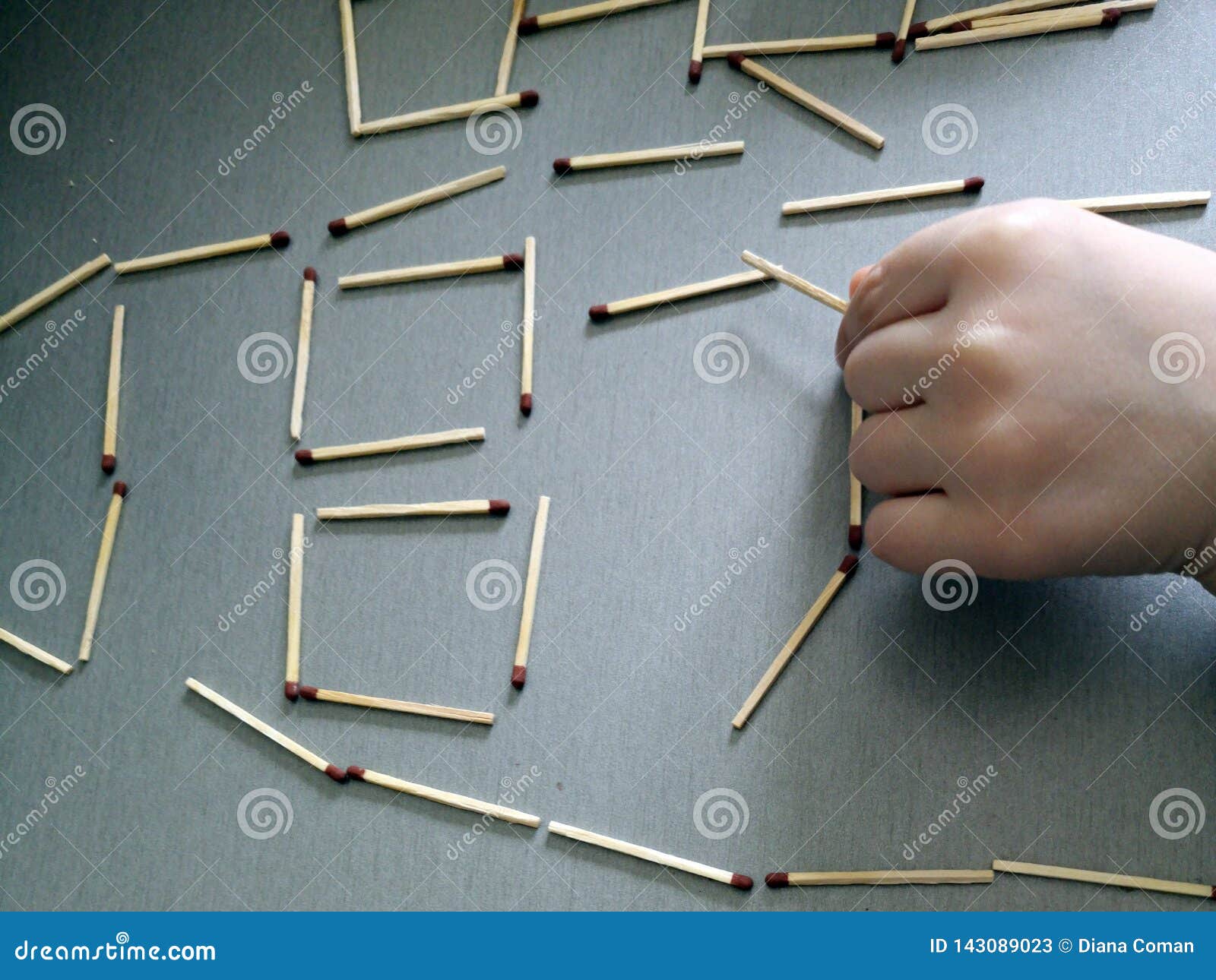 Child playing with matches stock image. Image of matches 143089023