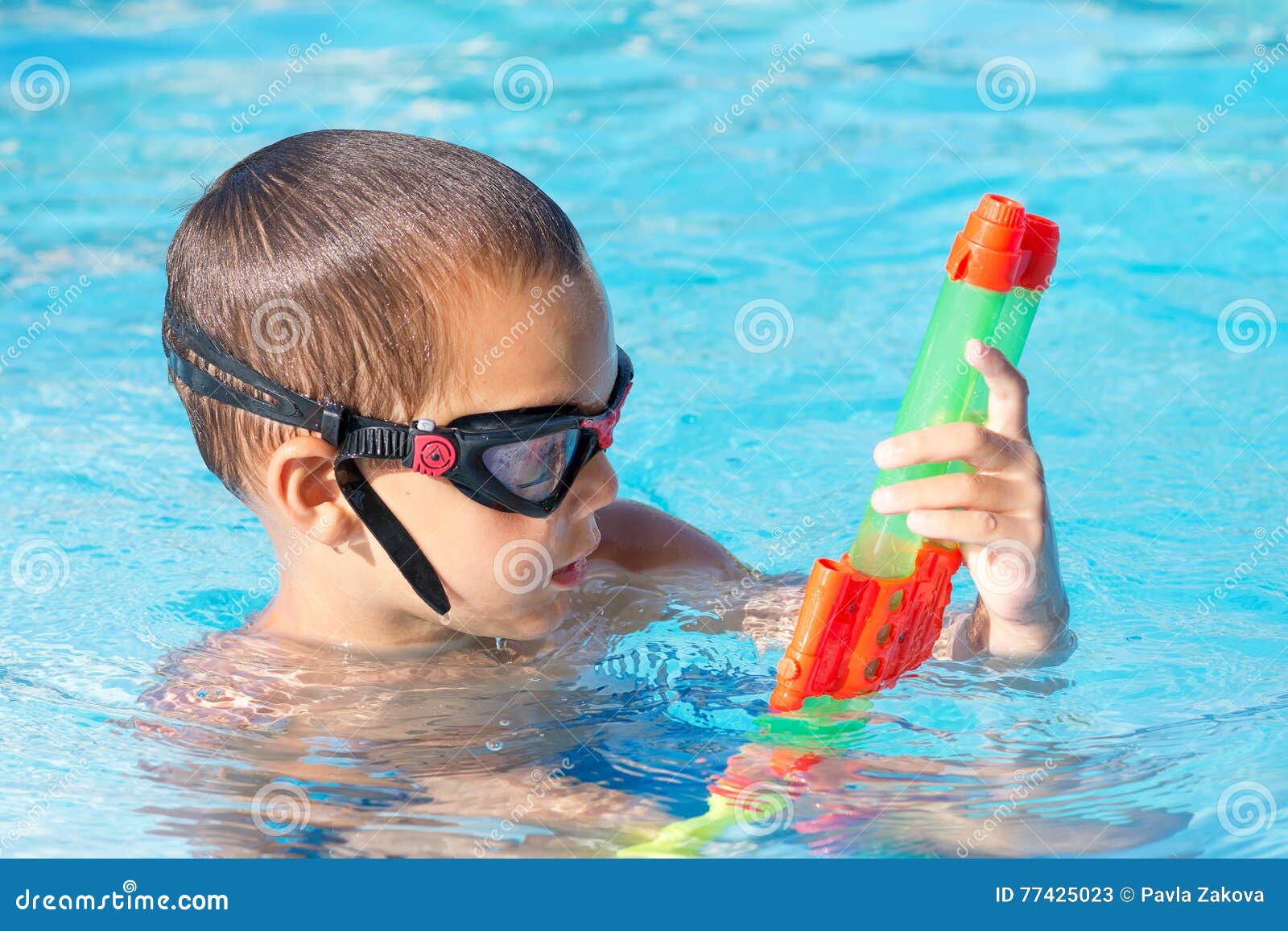 Child Playing in Swimming Pool with Water Gun Stock Image Image of