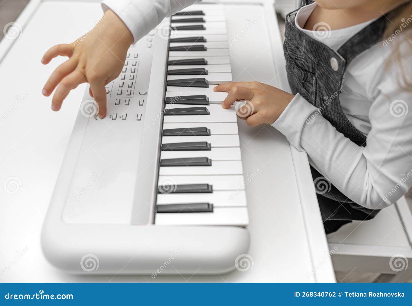 A Child Plays a Children& X27;s Synthesizer. Stock Photo Image of