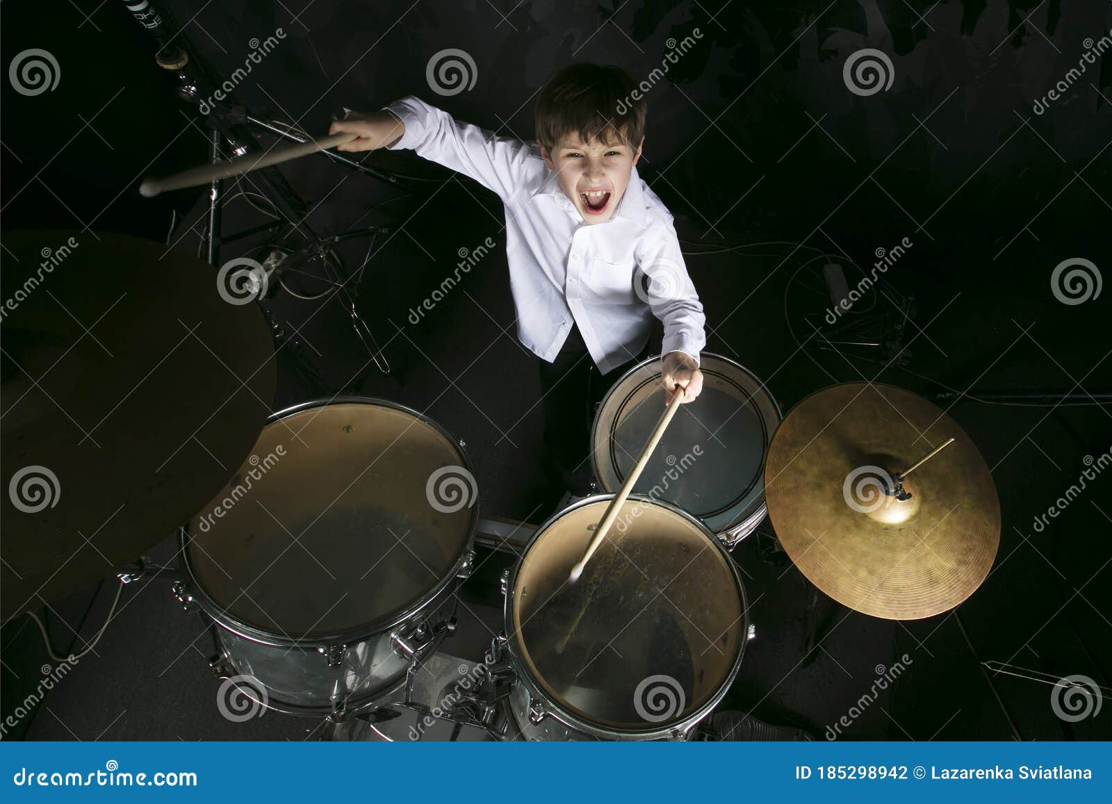 The child plays the drums. stock photo. Image of drummer 185298942