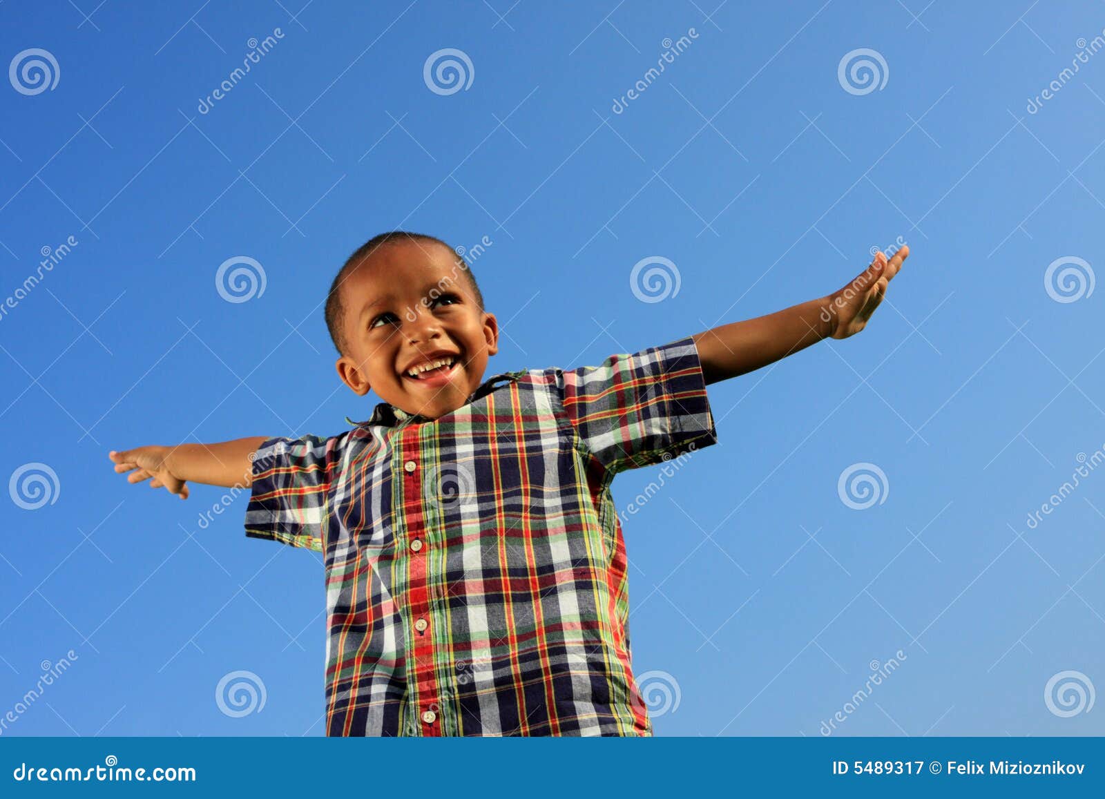 child pretending to fly