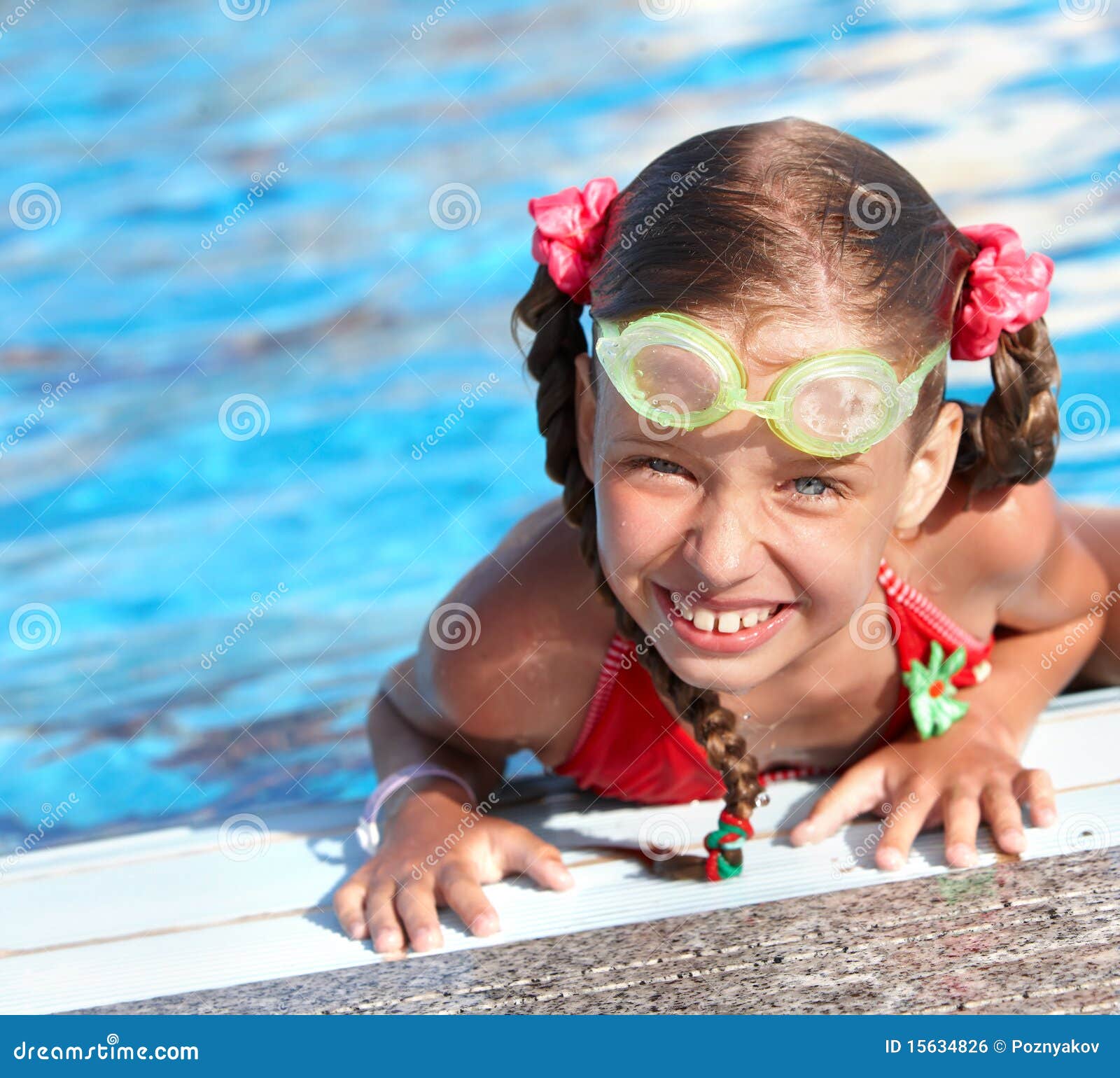 Child with Protective Goggles in Swimming Pool. Stock Photo Image of