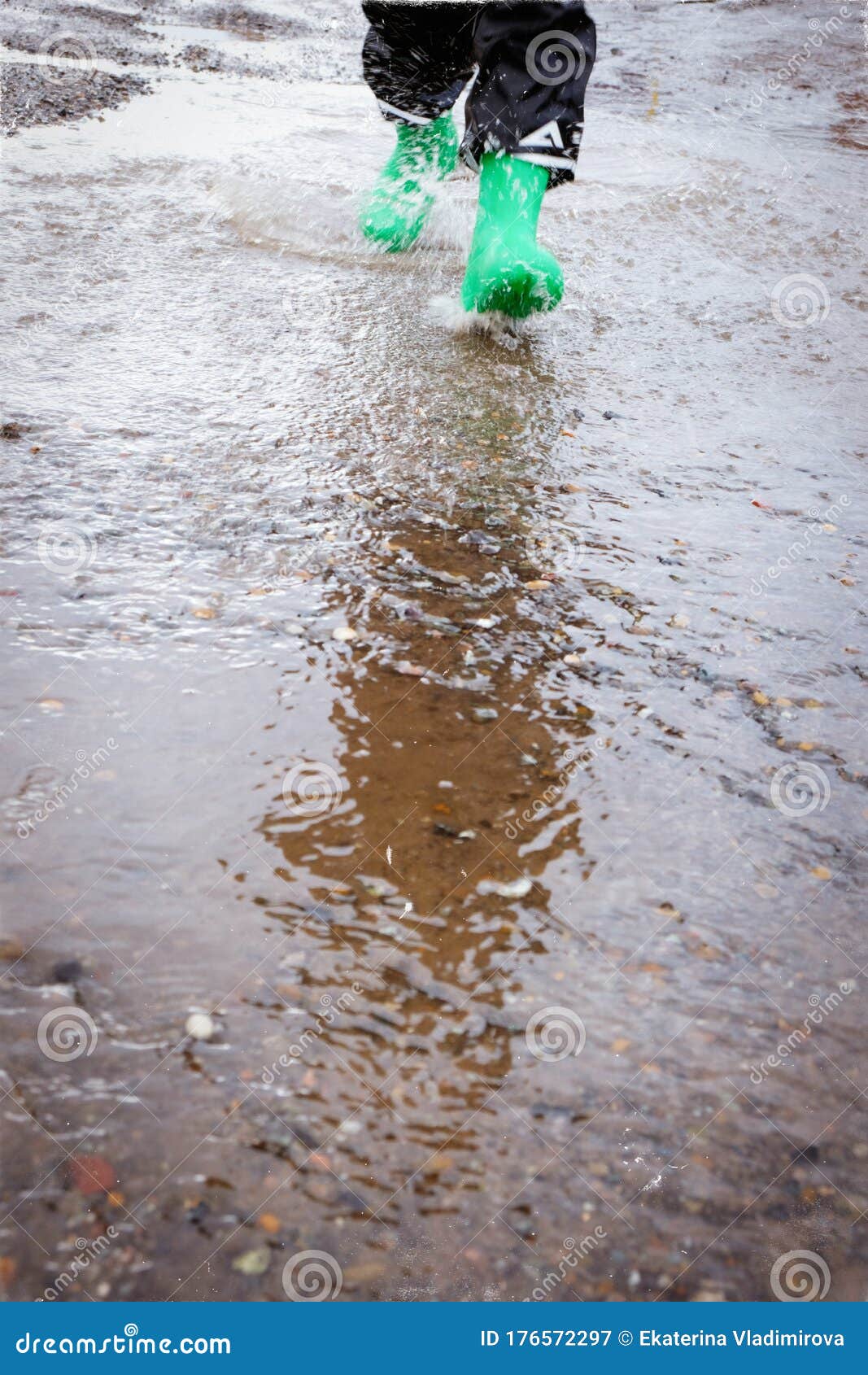 Child with Rain Boots Jumps into a Puddle Stock Image Image of jump, asphalt 176572297
