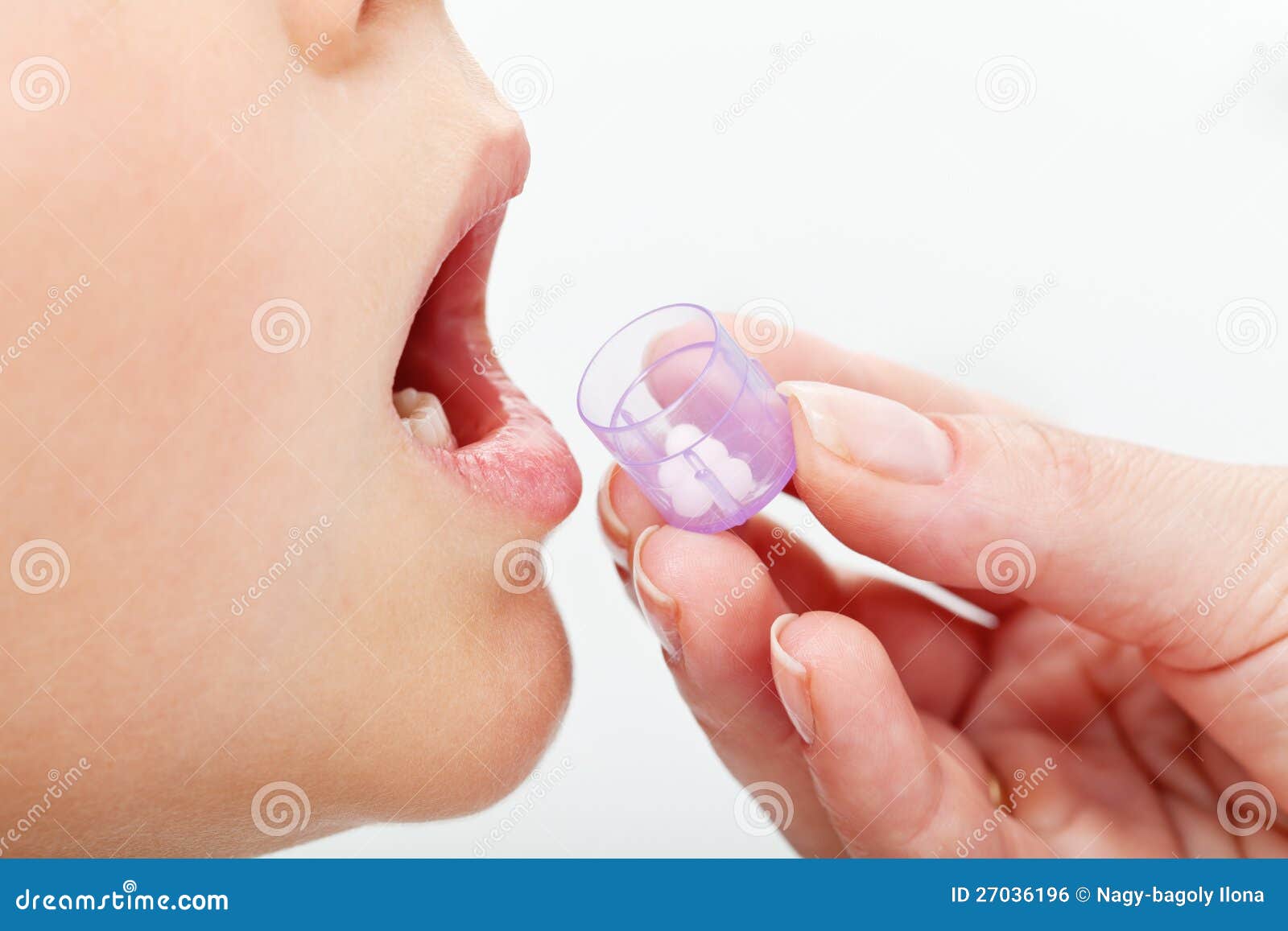child receiving homeopathic medication granules