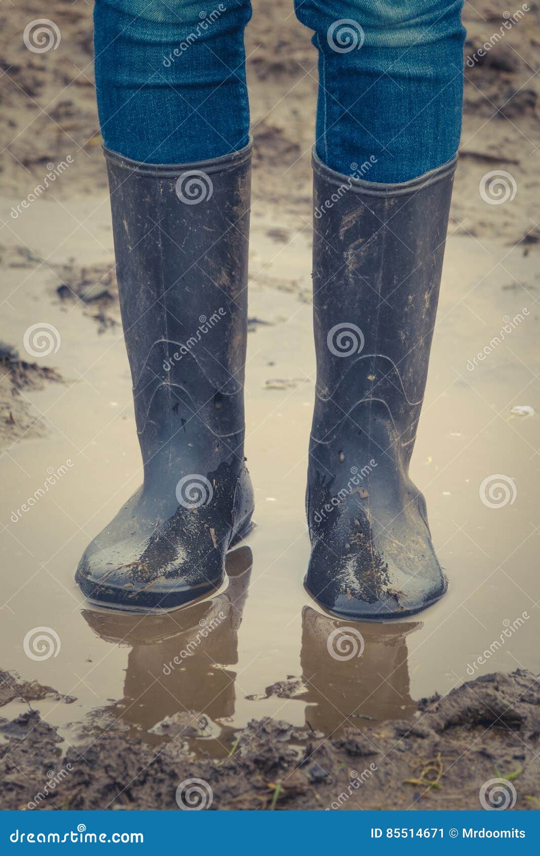 Child in Rubber Boots stock image. Image of autumn, muddy - 85514671