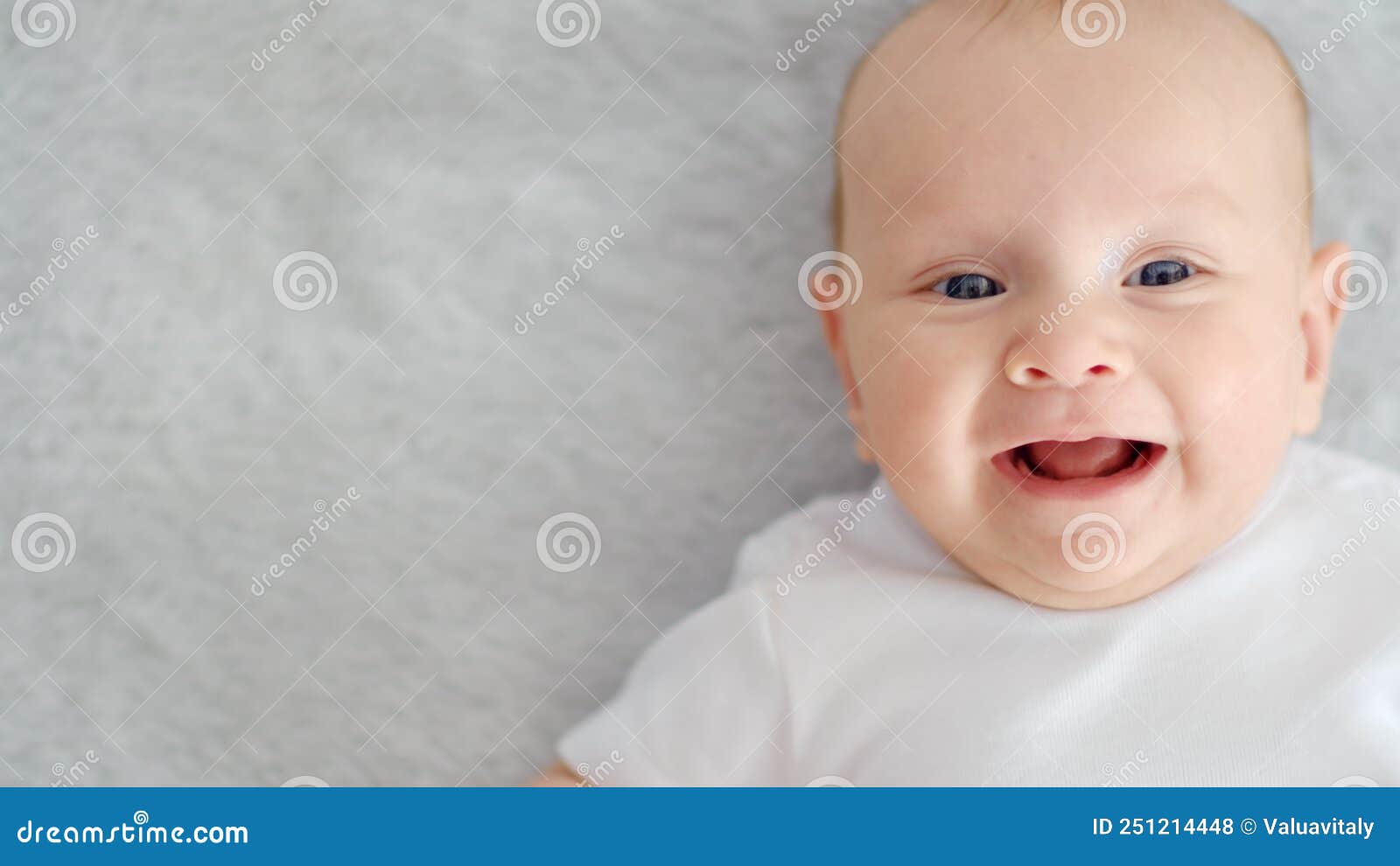 Child`s Face Of A Happy Newborn Baby Looking To Camera Healthy Newborn