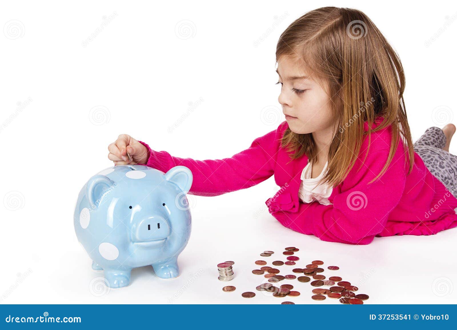 child saving money in a piggybank