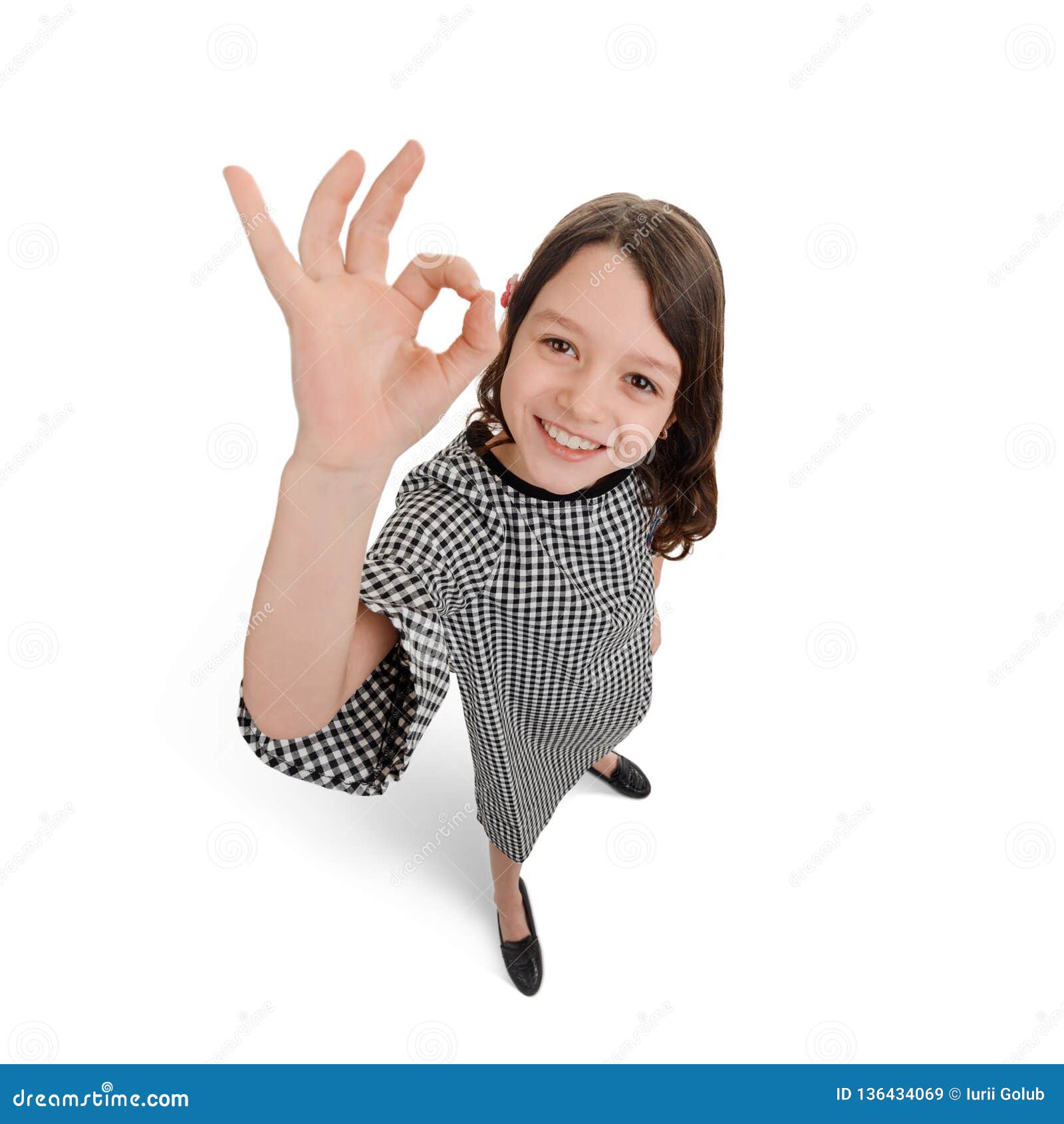 child showing alright sign