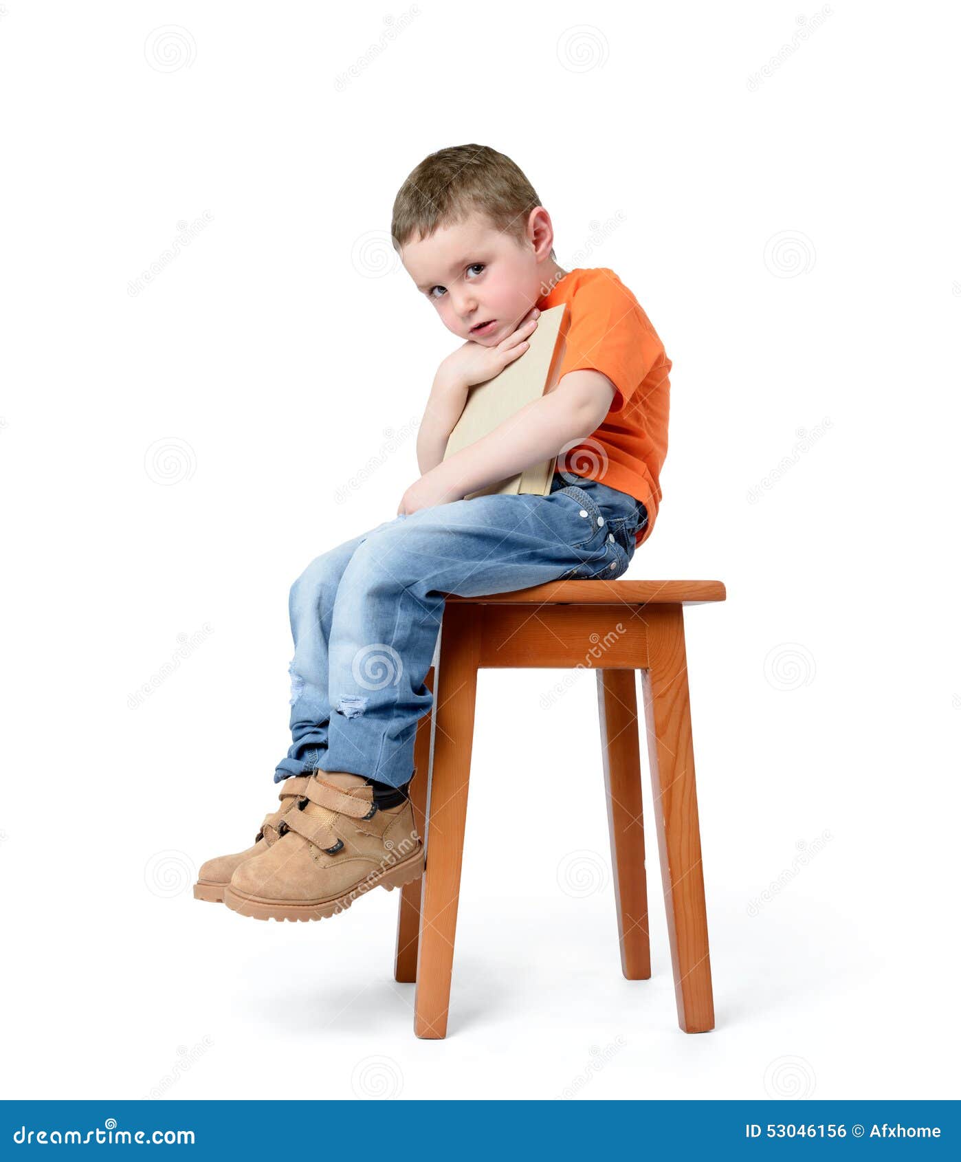 Child Sitting on a Chair with a Book, on White Background Stock Photo ...