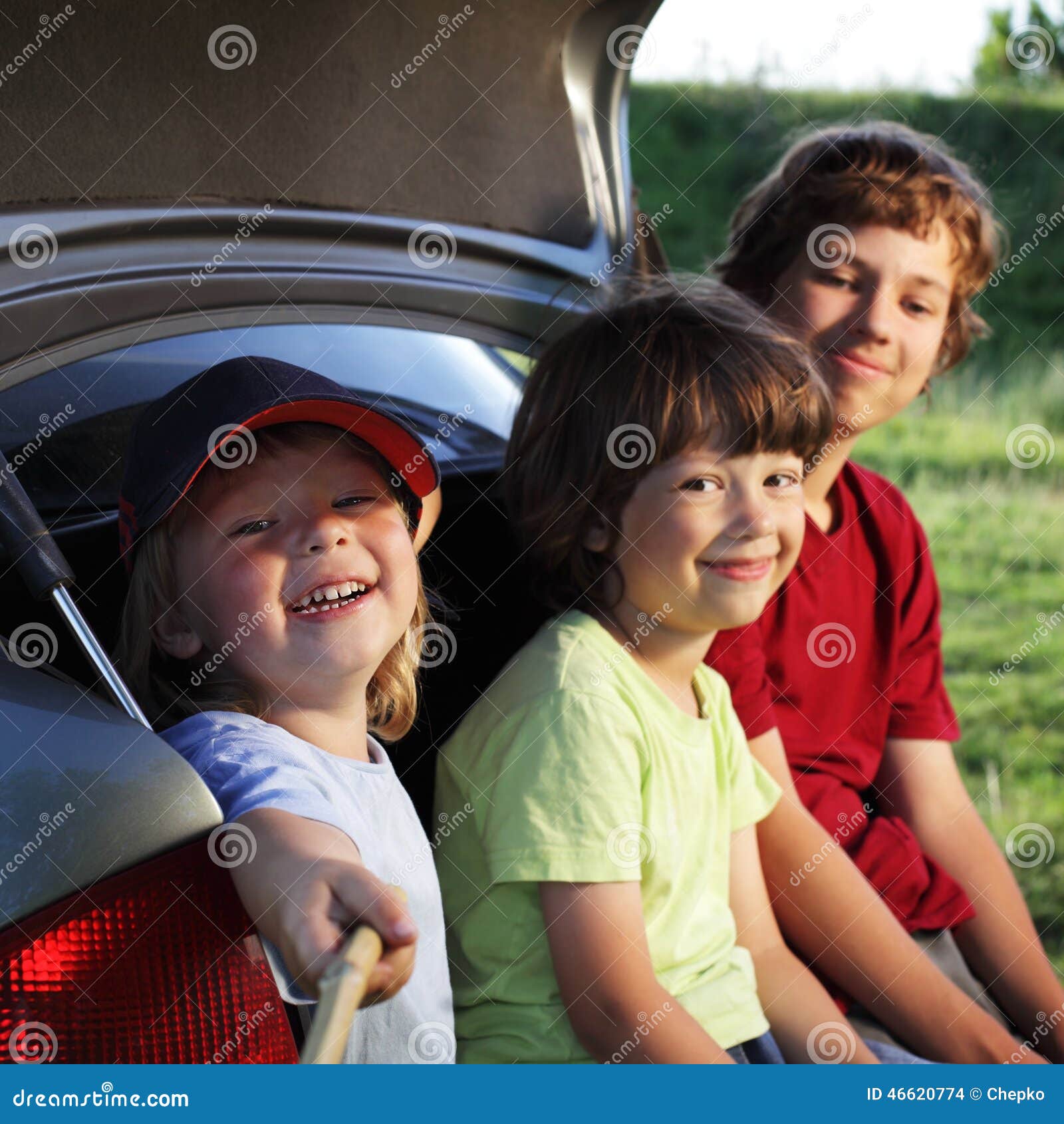 Child Sitting in the Trunk of a Car on Nature Stock Photo Image of